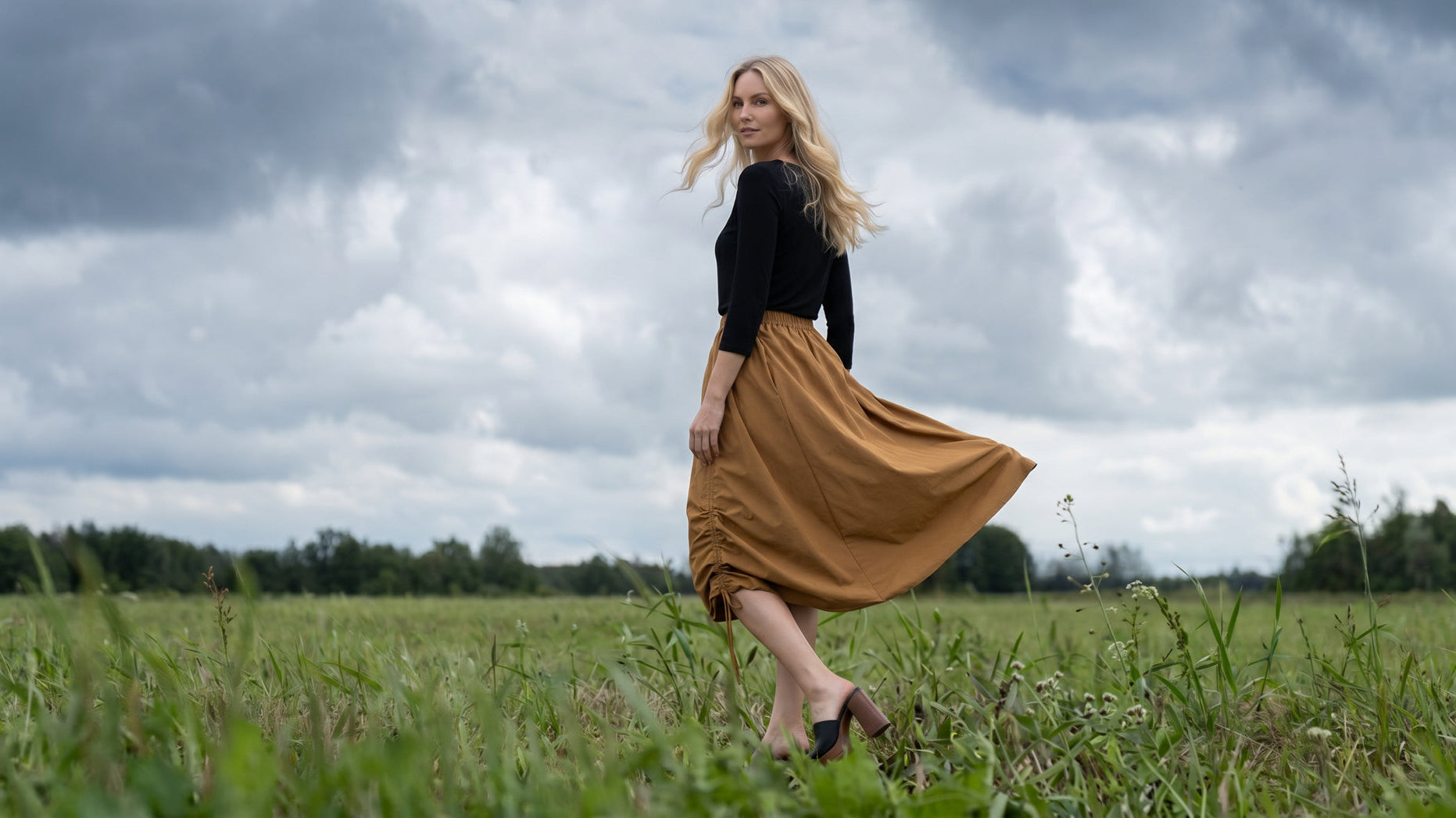 A picture of a women wearing the modest Oriana Skirt.