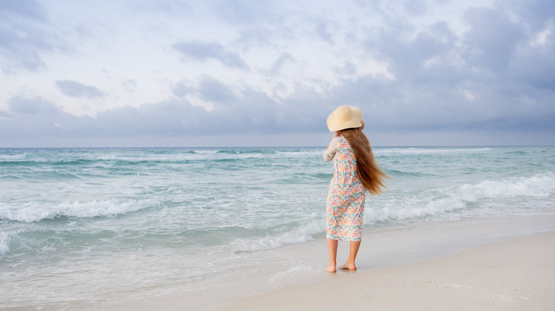 A modest swim wear dress with 3/4 sleeves and midi length.