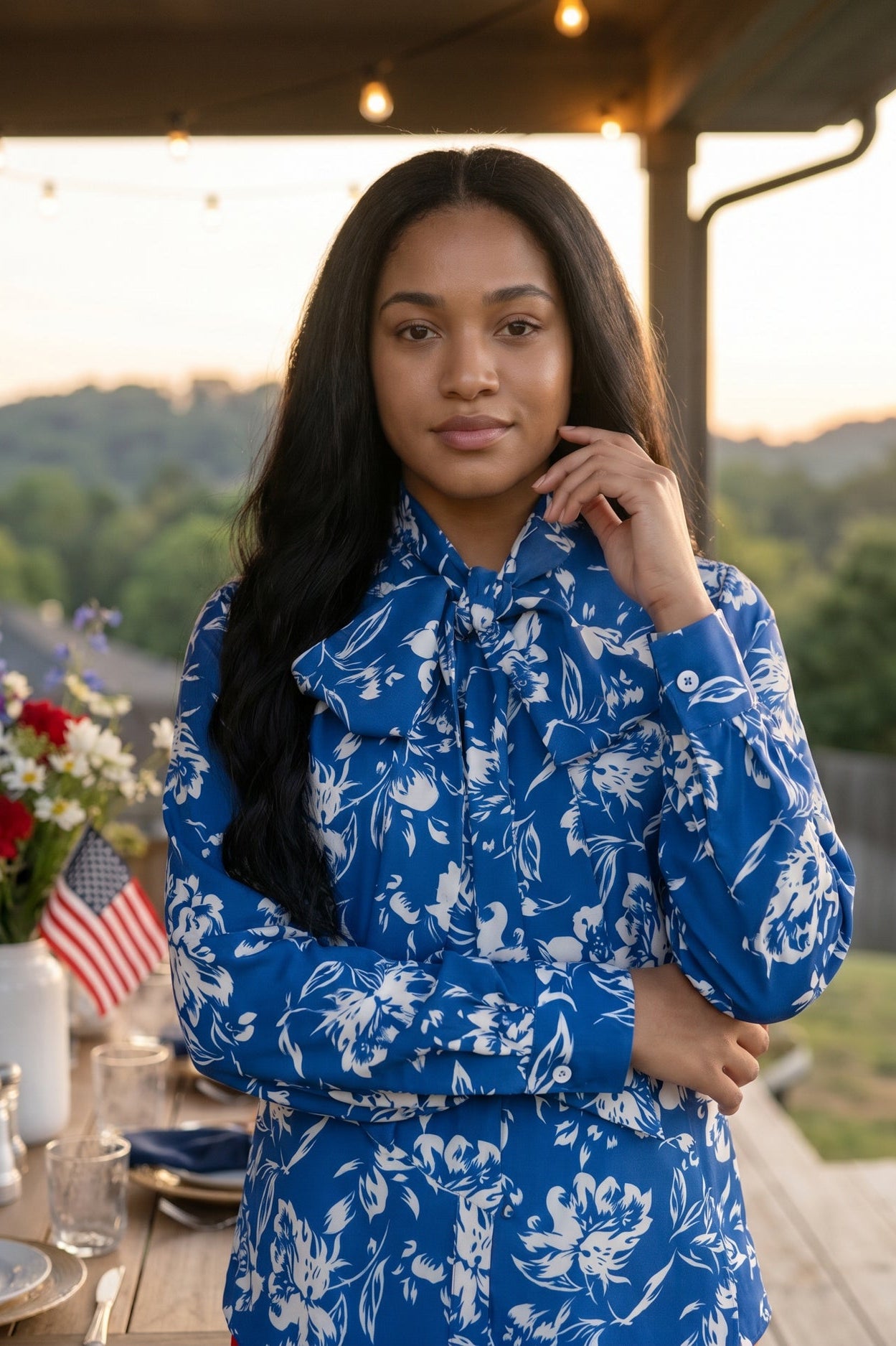 An image of a women wearing a blue and white shirt.