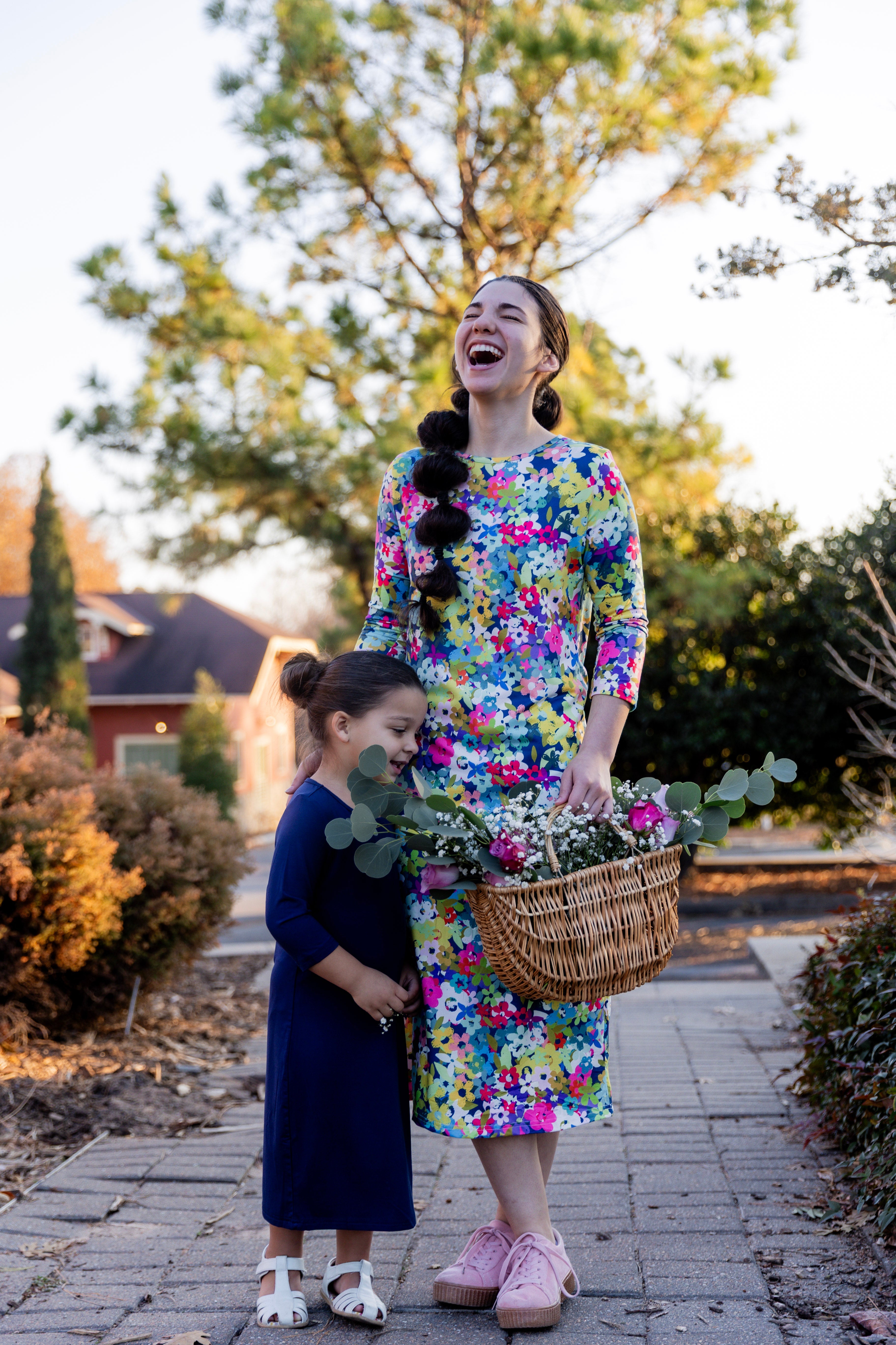 Model wearing the Nuggles® Original Midi Layering Dress in Wildflower Haze