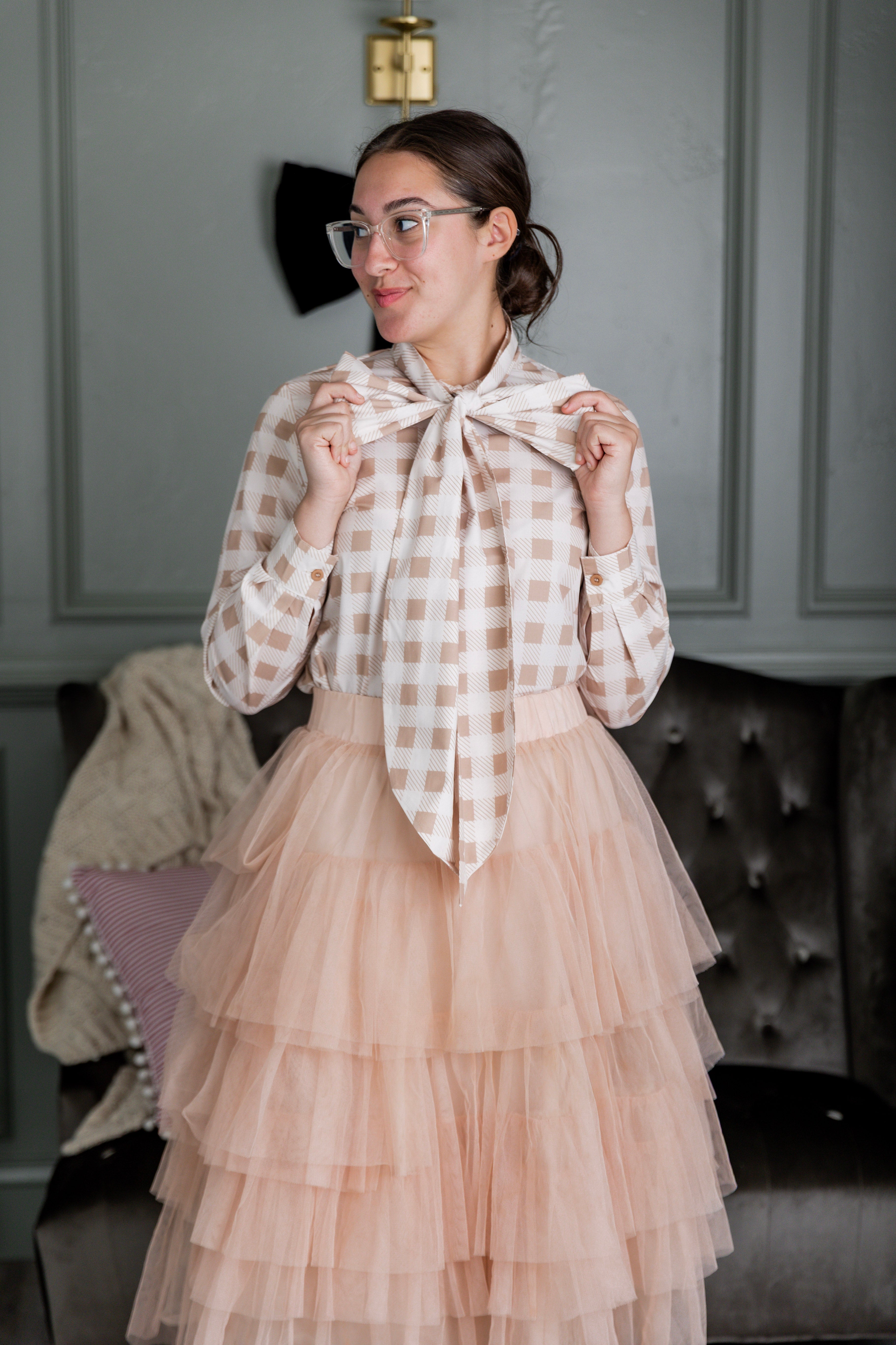 Women wearing a modest top in a beige and white print