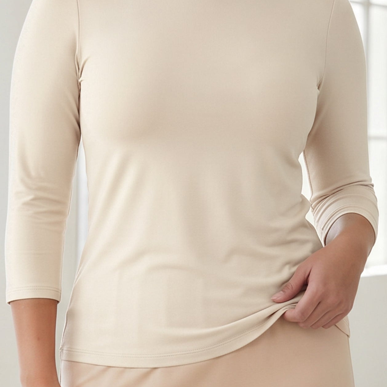 A close up shot of the essential tee in 3/4 length sleeves.