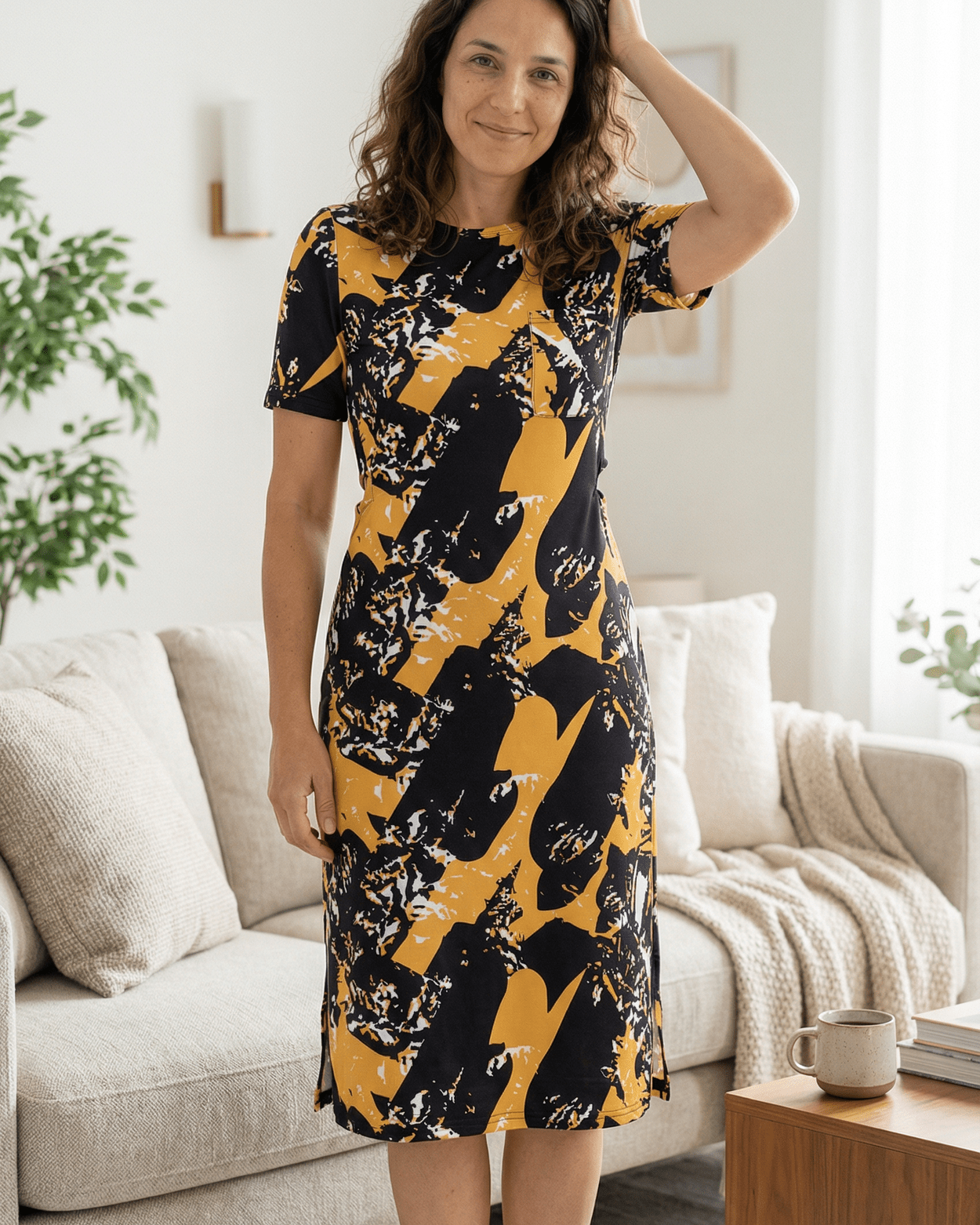Model wearing the Nuggles® Aviva Dress in Golden Drift
