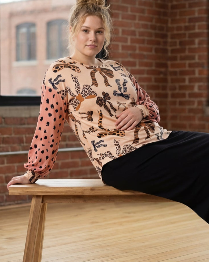 Model wearing Nuggles® Bryauna Top in Love & Leopard