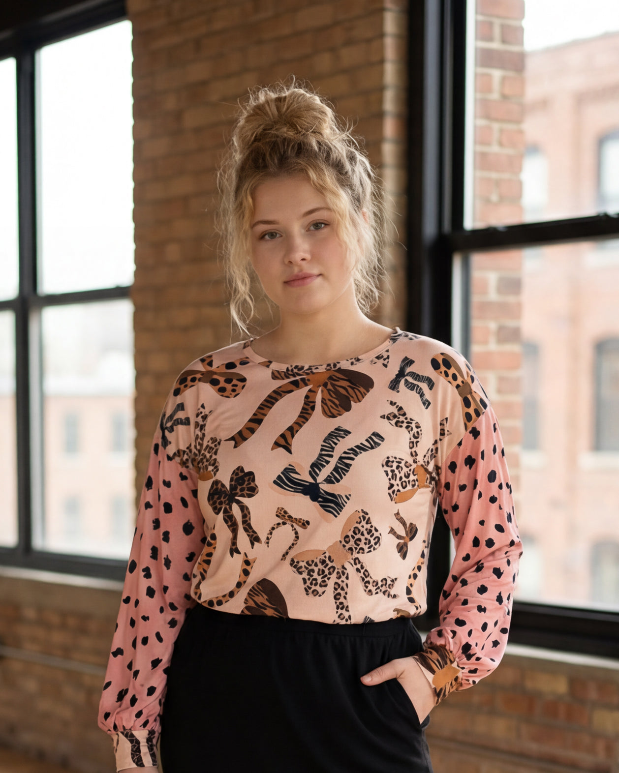 Model wearing Nuggles® Bryauna Top in Love & Leopard