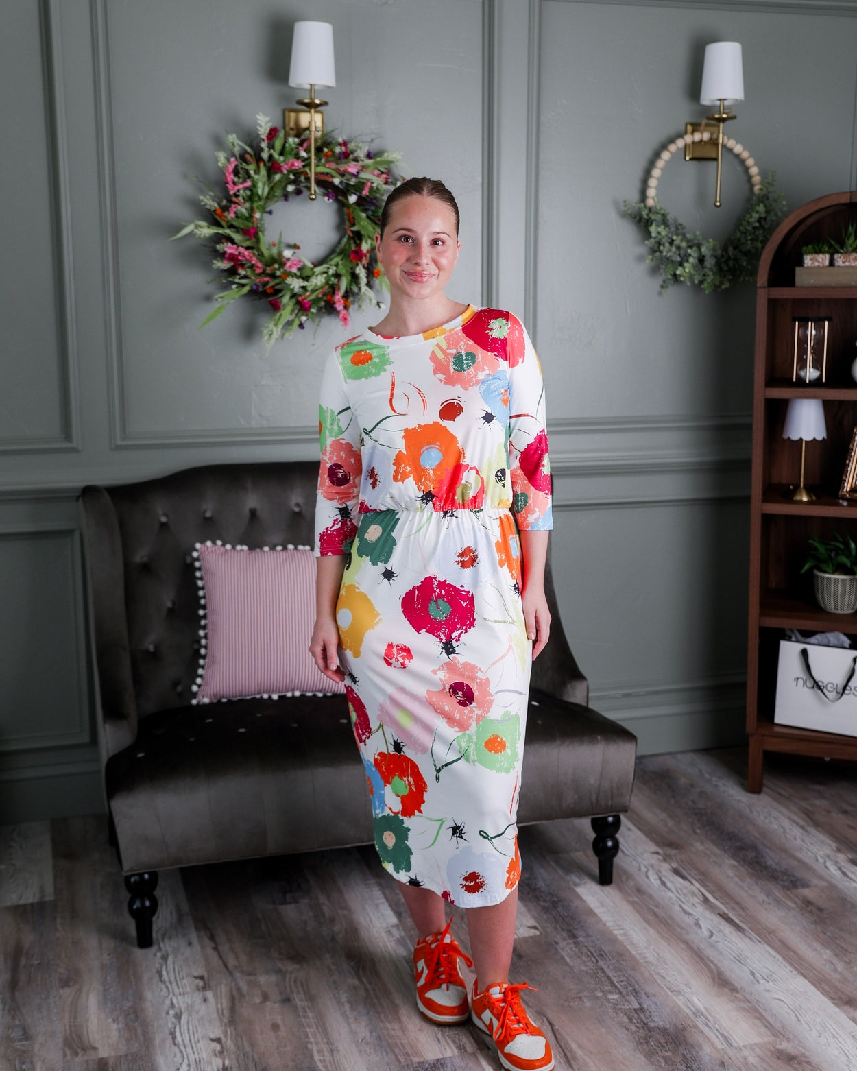 Model wearing Nuggles® Harper Jane Dress in Party Blooms