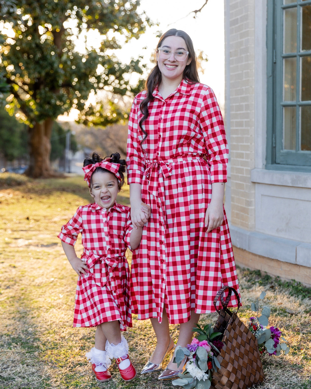 Model wearing the Nuggles® Girls' Rachel Dress in Cherry Jam