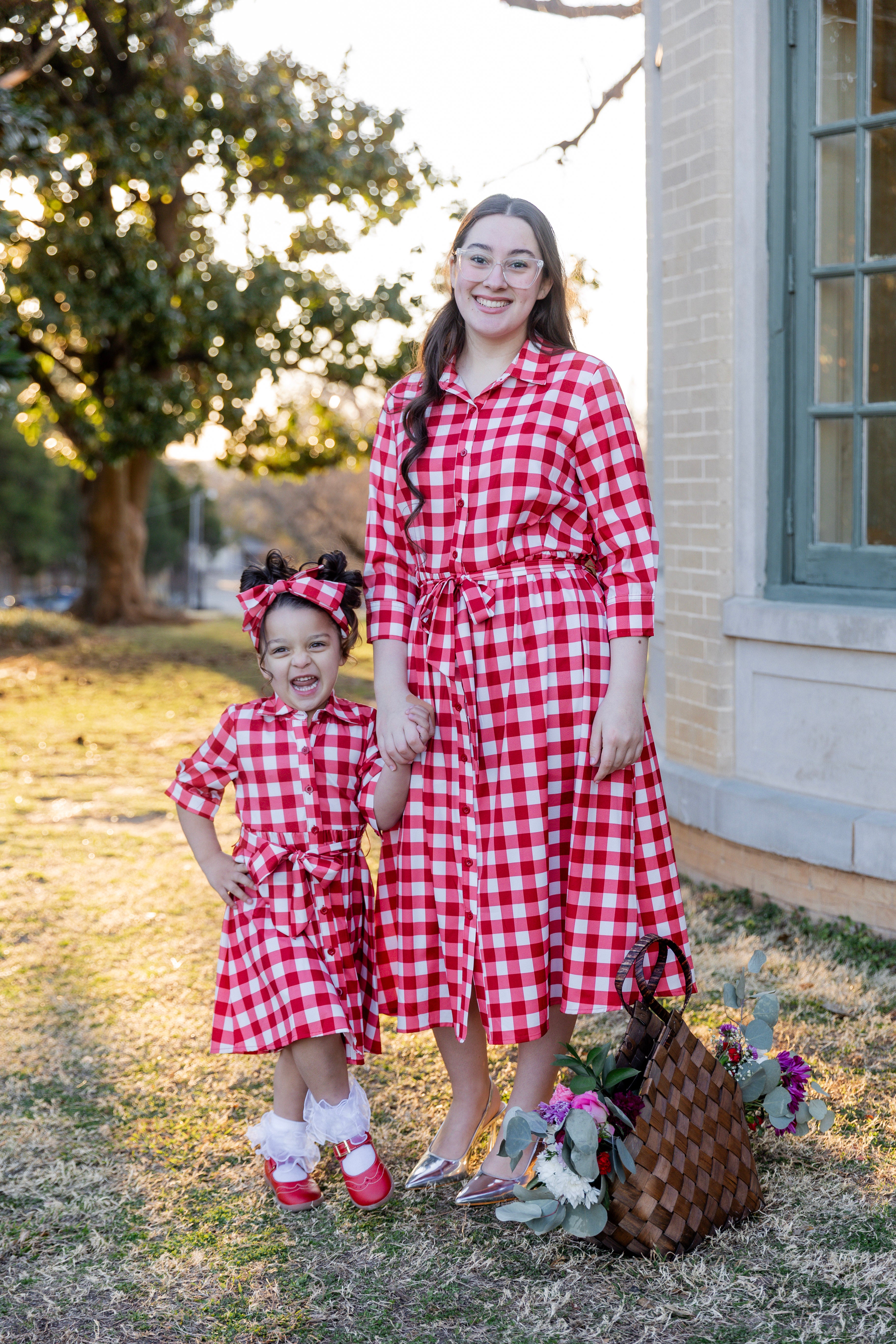 Model wearing the Nuggles® Girls' Rachel Dress in Cherry Jam