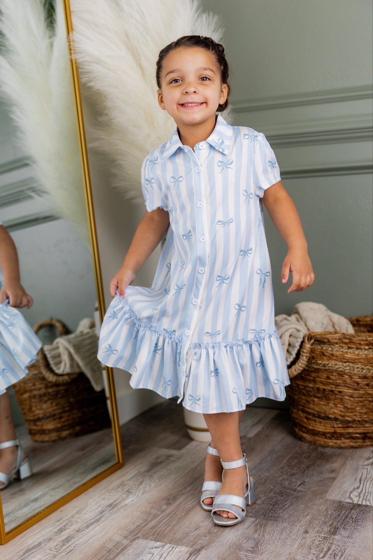 Model wearing Nuggles® Girls' Ellie Dress Dress in Sweet Ribbon Stripe