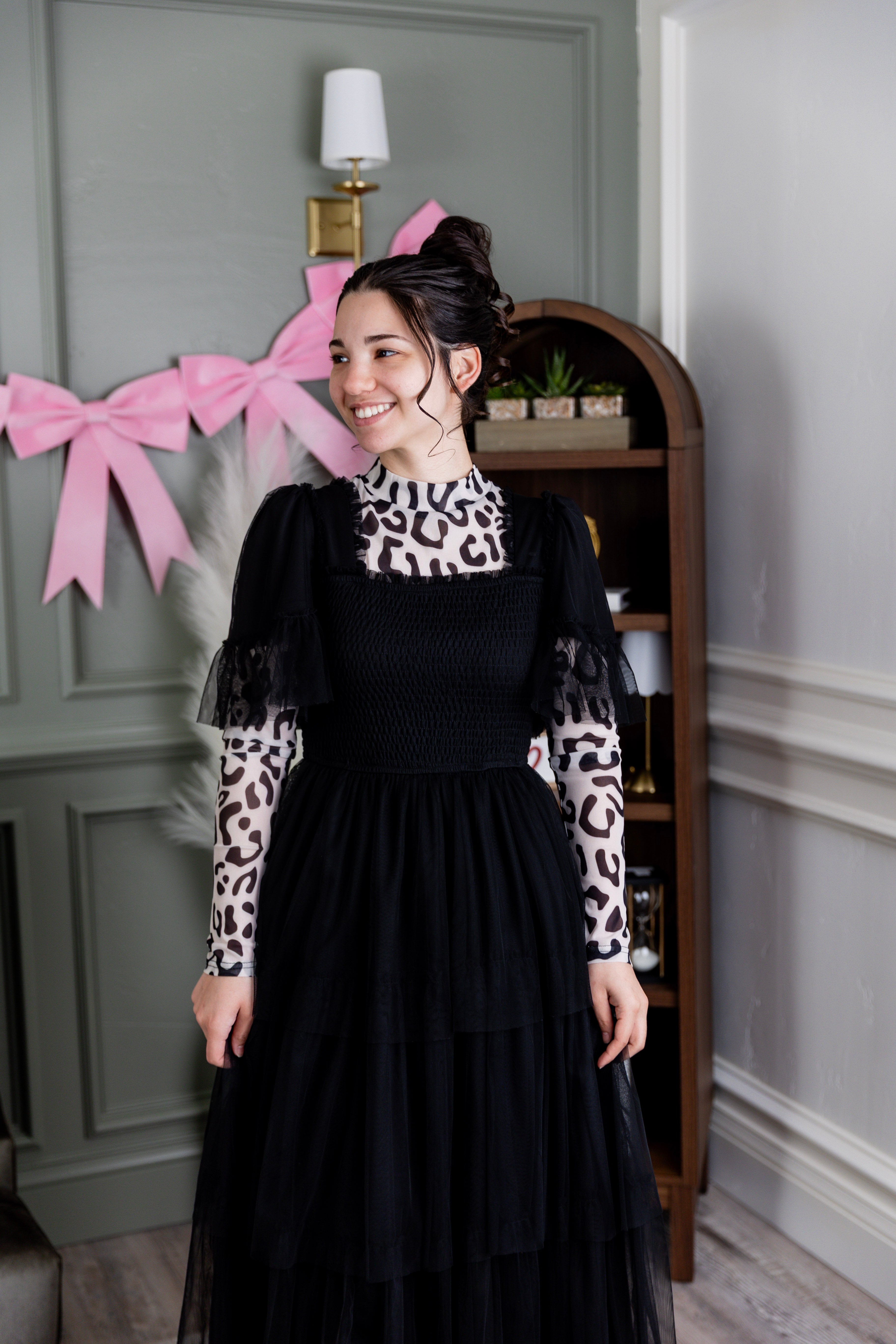 Model wearing Nuggles® Mesh Tee top in Snow Leopard