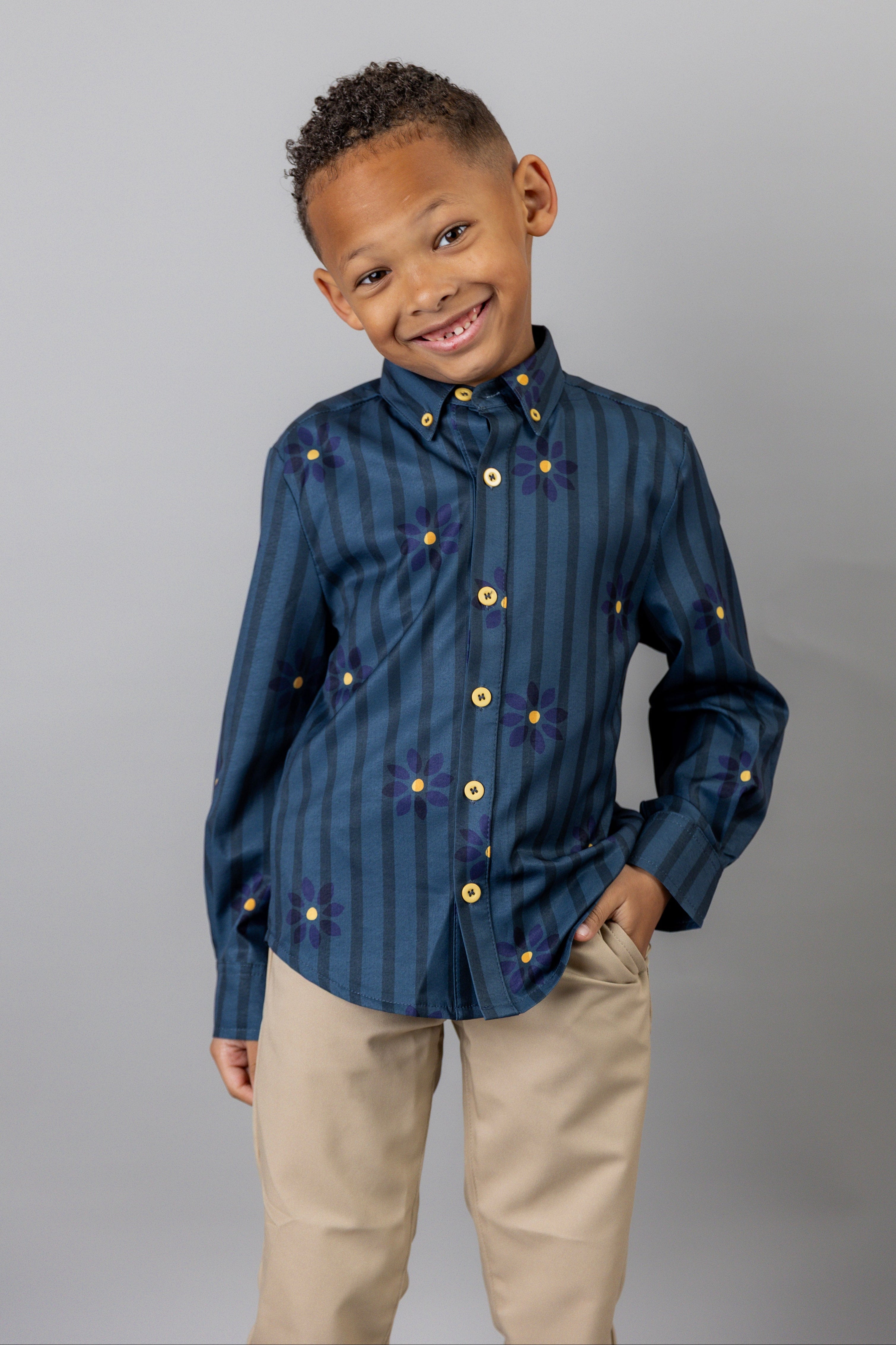 Model wearing Nuggles® Boy's Button Down Shirt in Pinstripe Ditsy