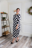 Model wearing Emma Bubble Dress in pretty prints, showcasing full bubble skirt and modest fit.