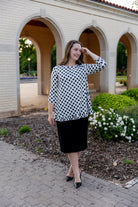 Model wearing the Avery Top, featuring modest 3/4 sleeves and a flowy, flattering fit.