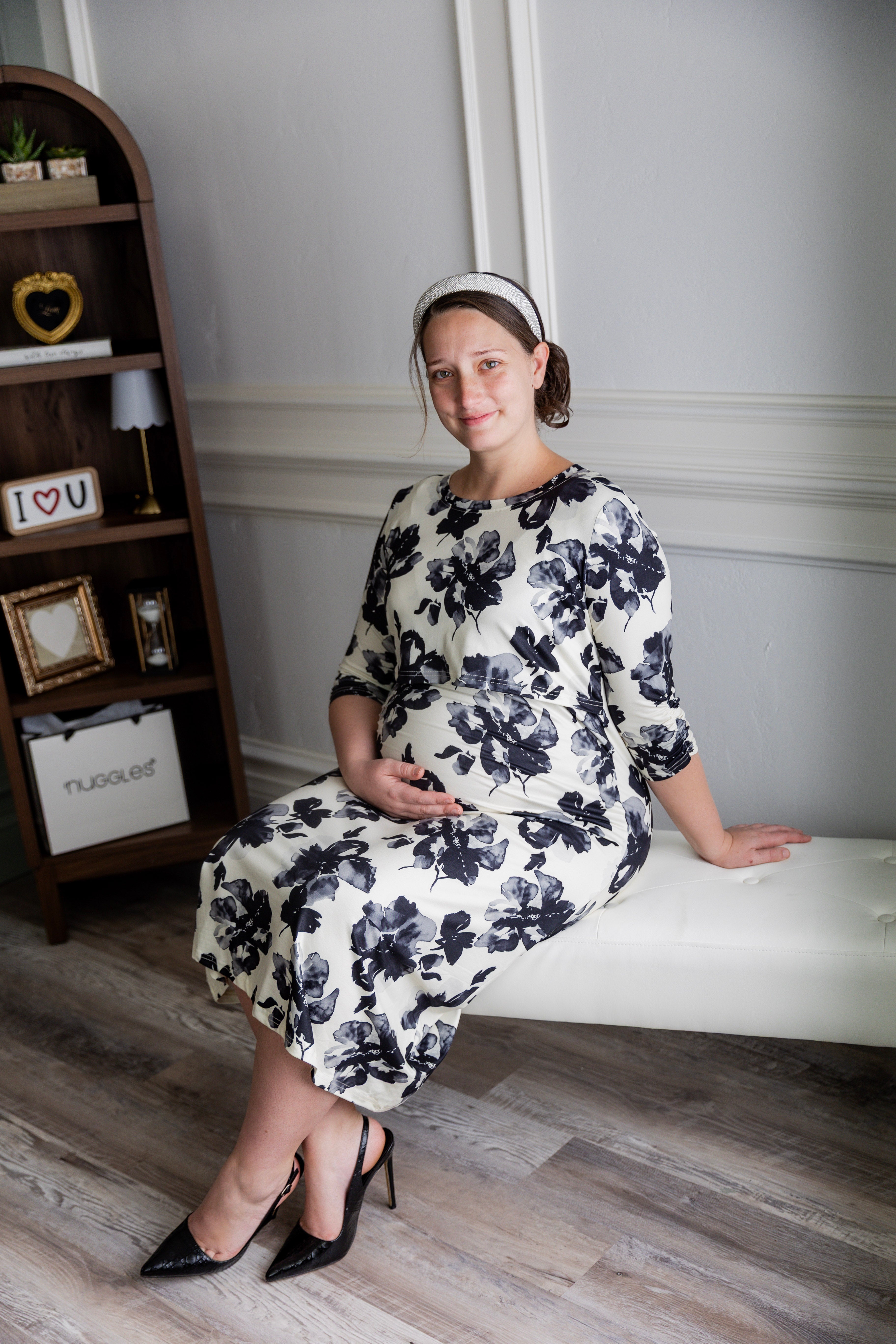 Model wearing Nuggles® Nalani Nursing Dress in Ink Blossom