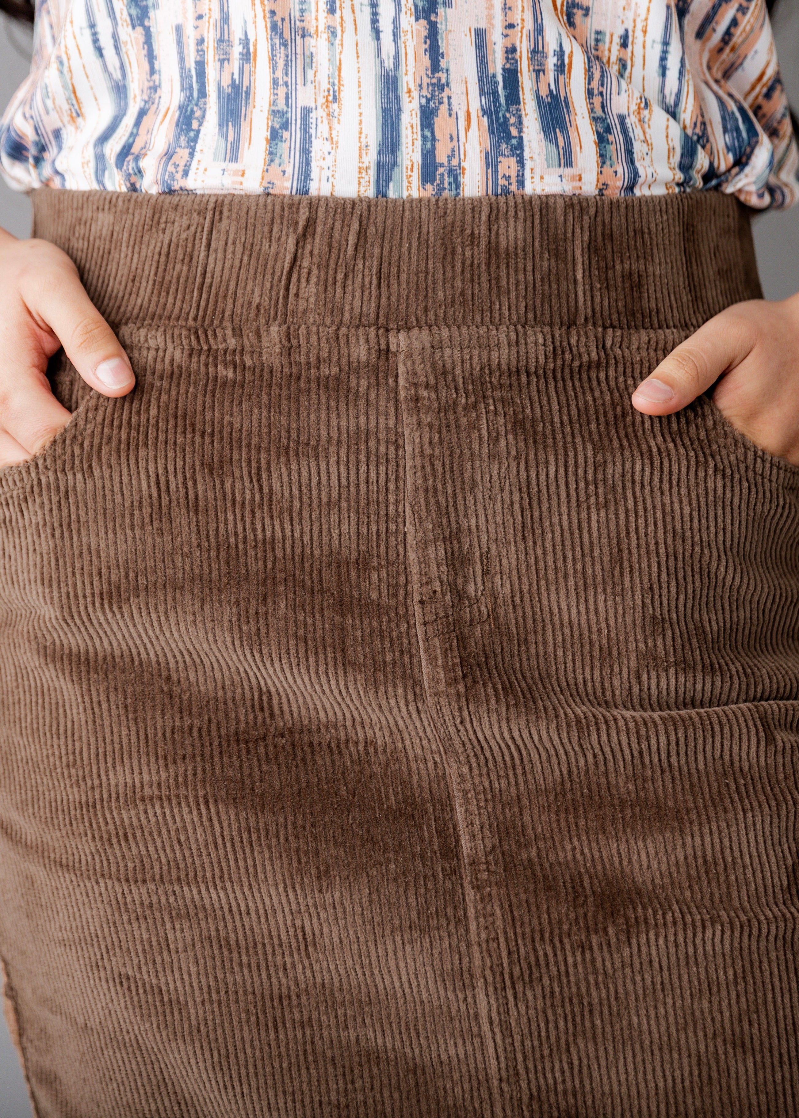 Model wearing Nuggles® 27-inch corduroy skirt
