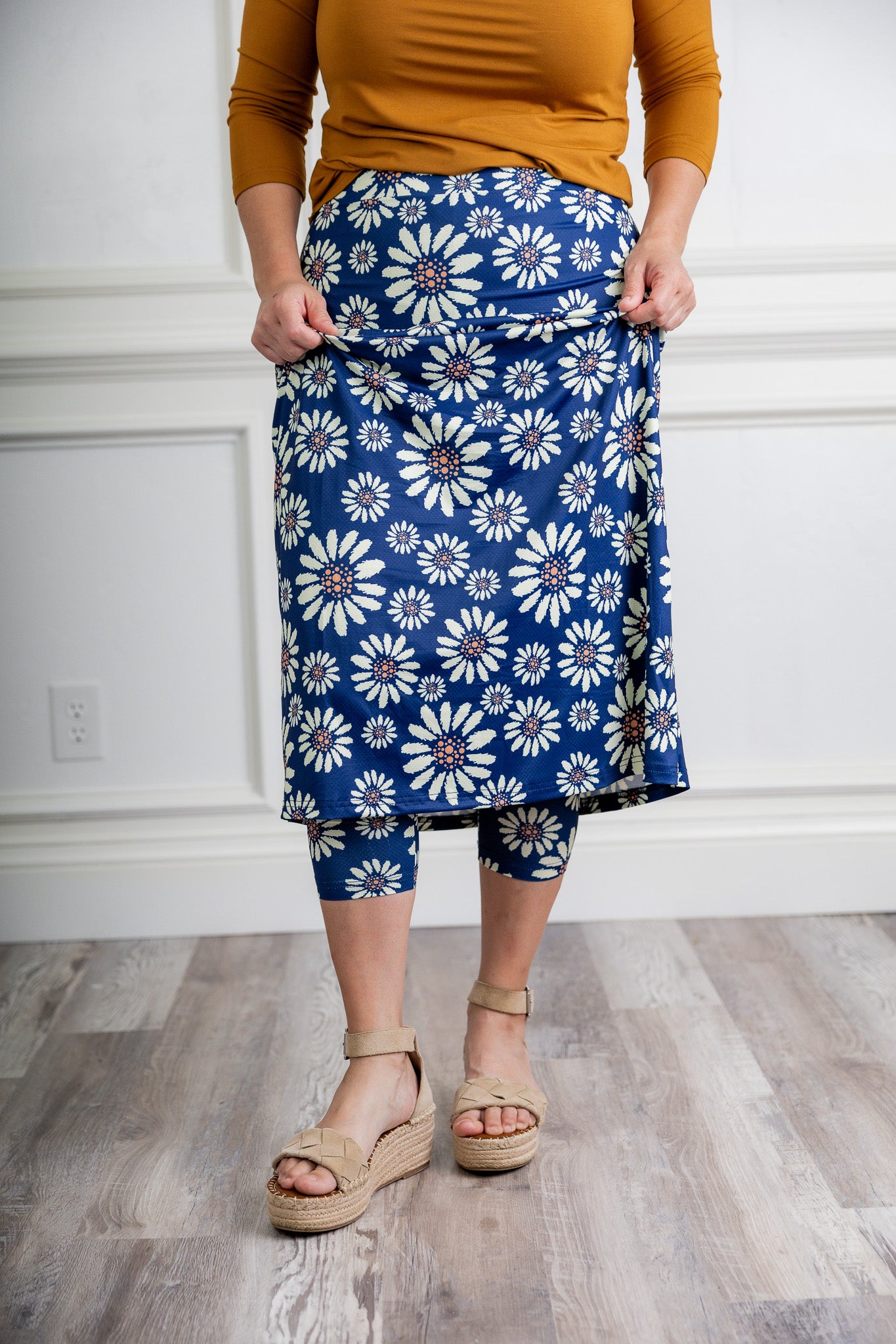 Modest activewear skirt with built-in leggings for women, breathable athletic fabric, paired with sneakers – perfect for workouts or casual wear.