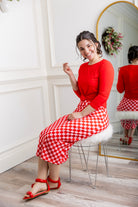 Model showcasing  Nuggles® midi tee skirts in various solid colors, modest 27" and 31" lengths