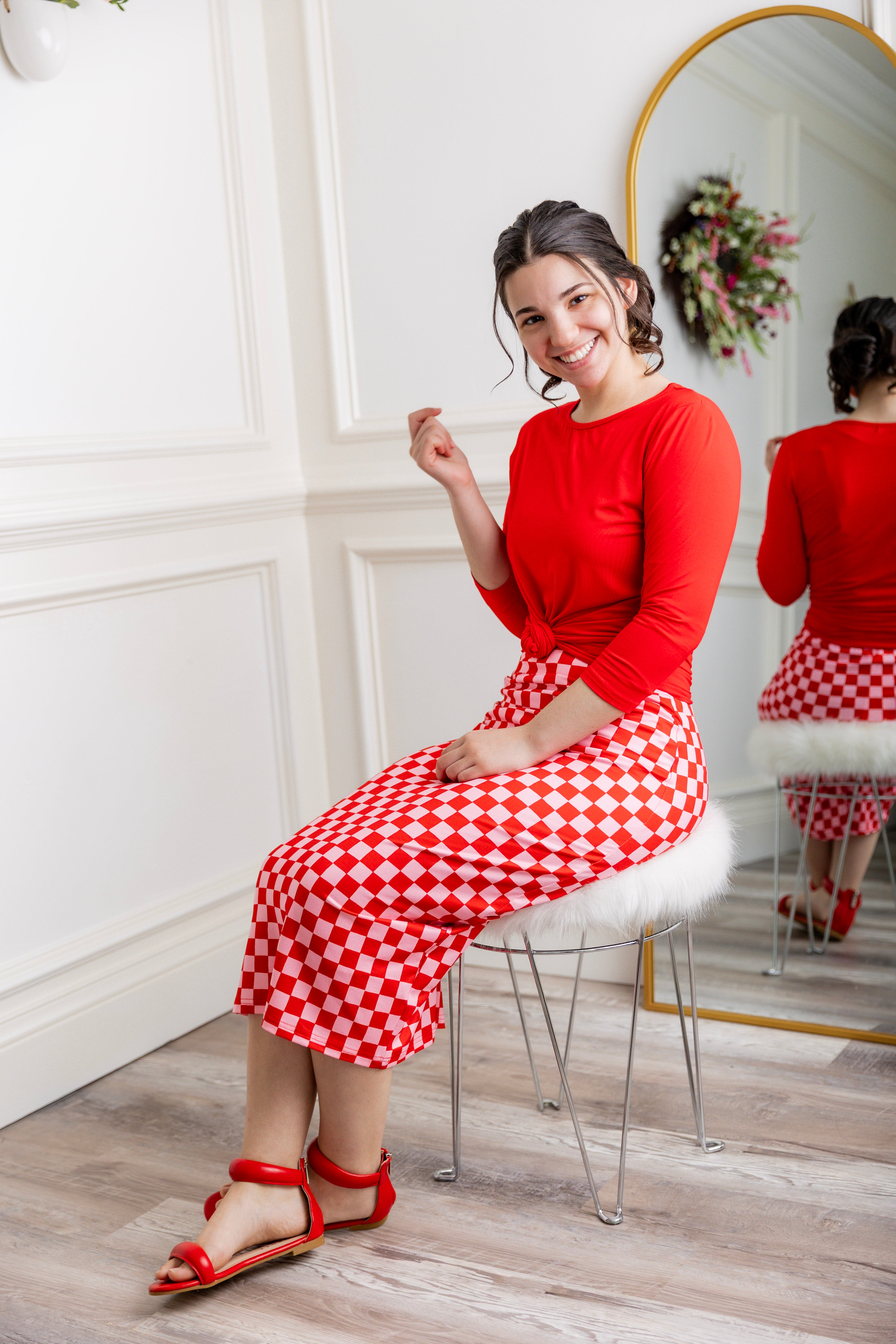 Model showcasing  Nuggles® midi tee skirts in various solid colors, modest 27" and 31" lengths