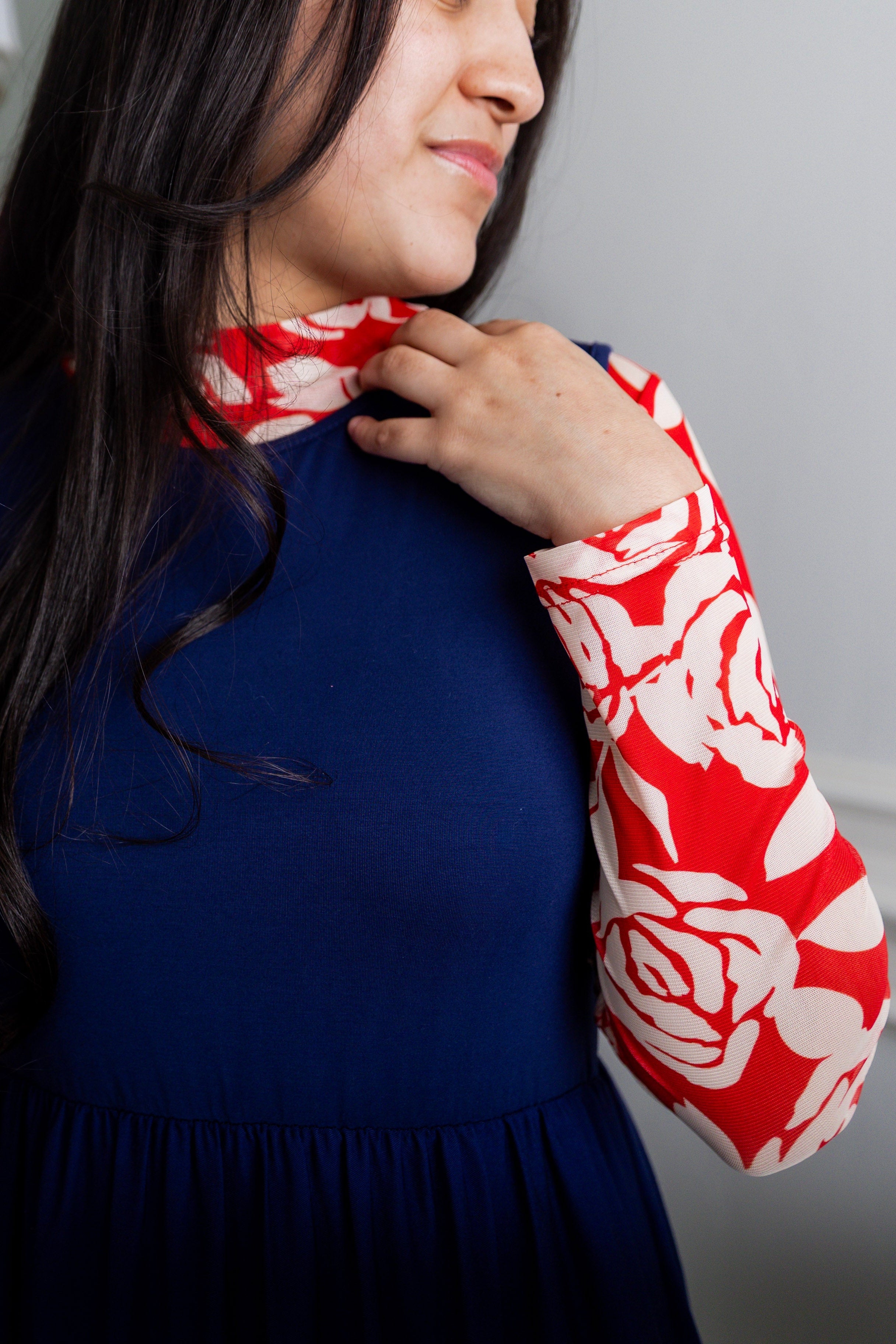 Model wearing Nuggles® Mesh Tee top in Rosie Rouge