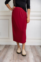 Model wearing a 31-inch classic lightweight midi skirt with an elastic waistband, styled modestly for everyday or church wear.