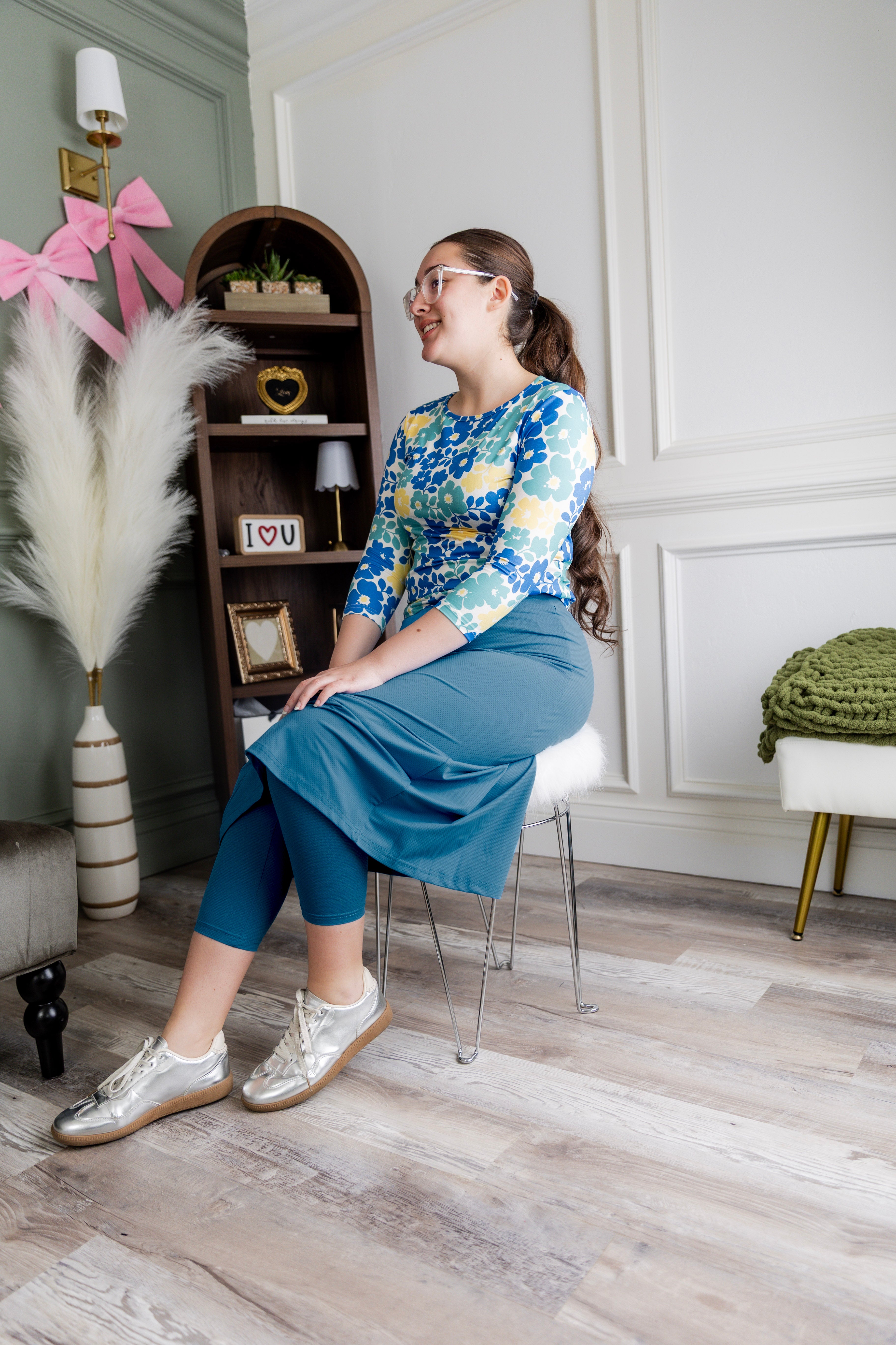 Model wearing Nuggles® 31" All-Sport Skirt in Turquoise