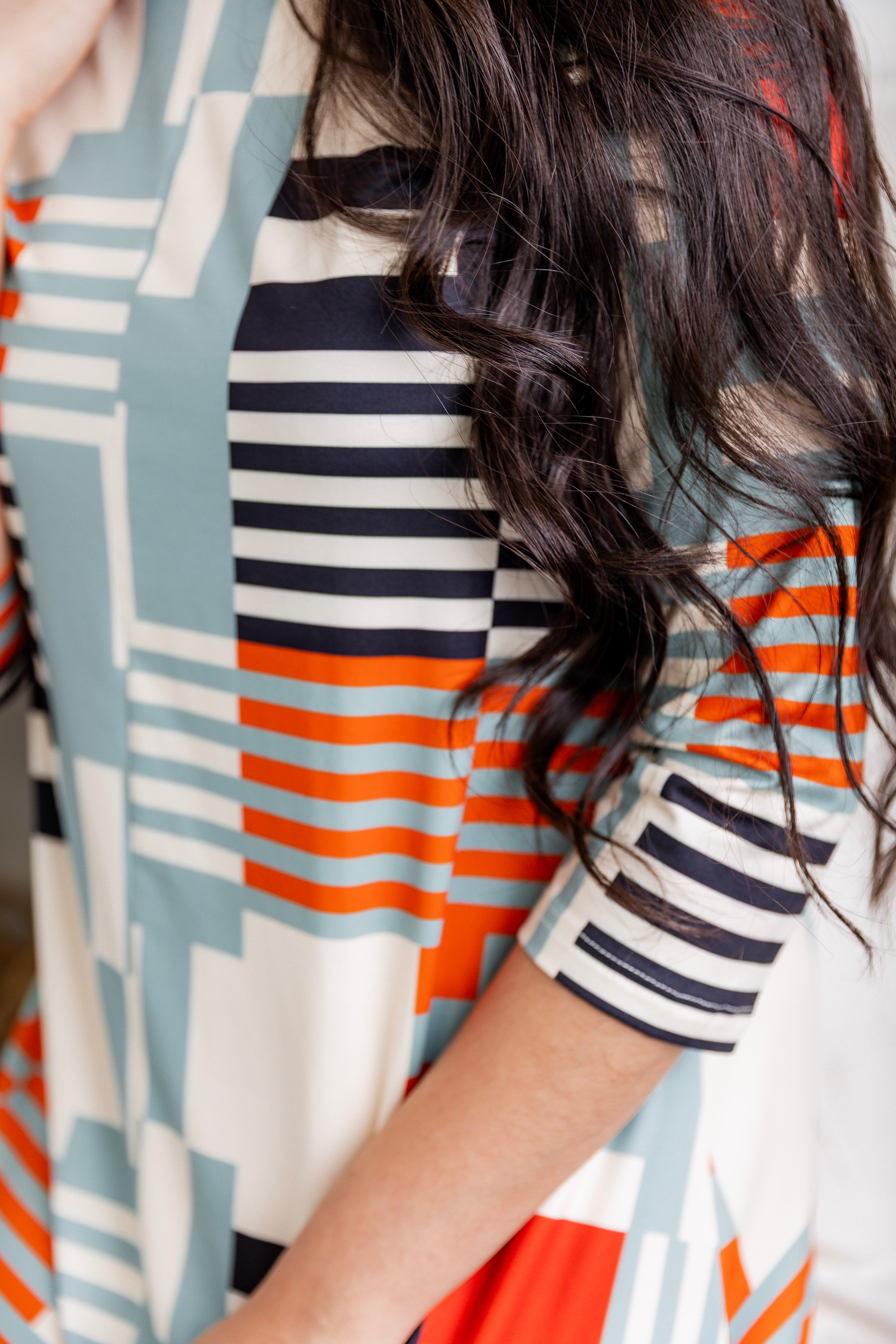 Model wearing the Nuggles® Liana Dress – modest midi dress with ¾ sleeves