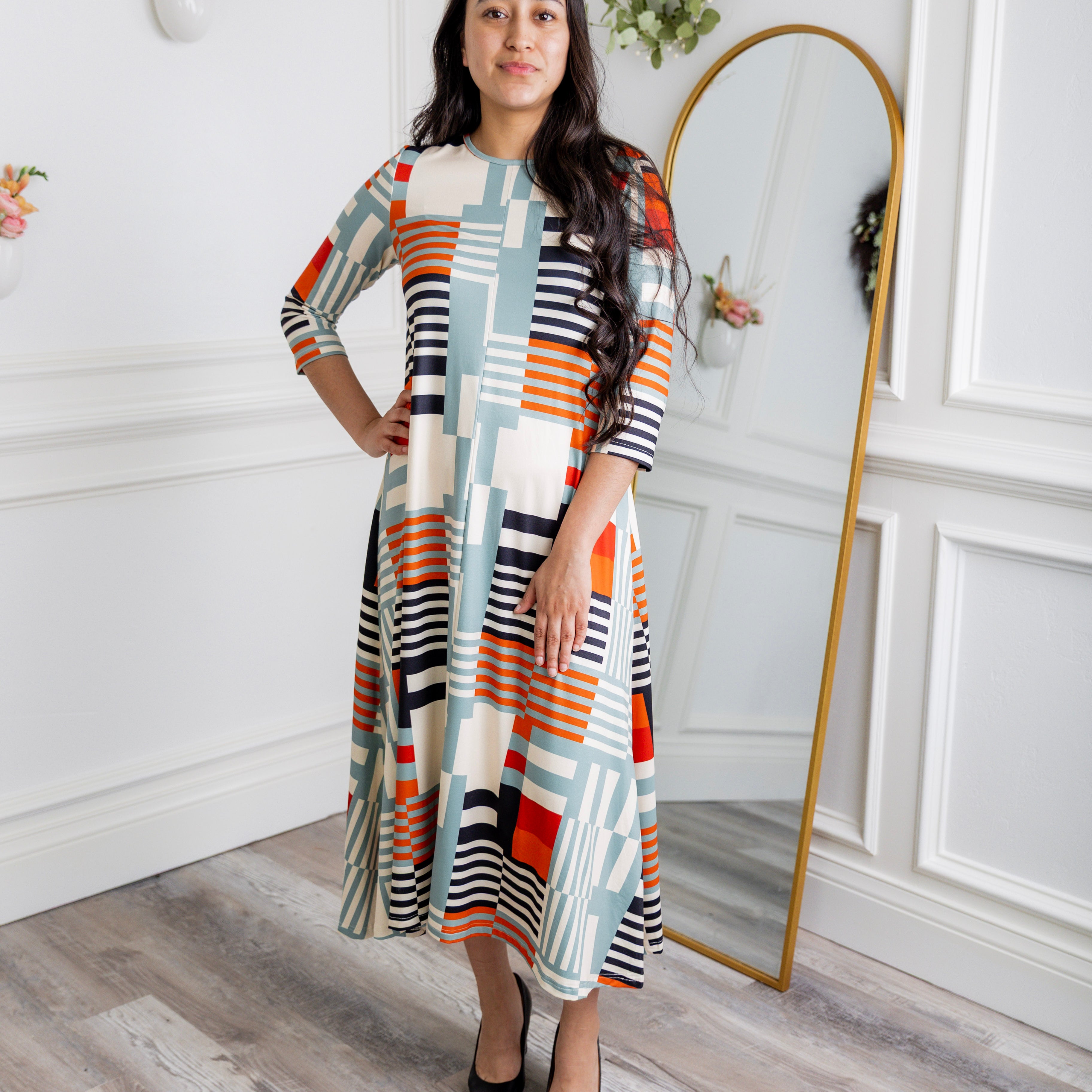 Model wearing the Nuggles® Liana Dress – modest midi dress with ¾ sleeves