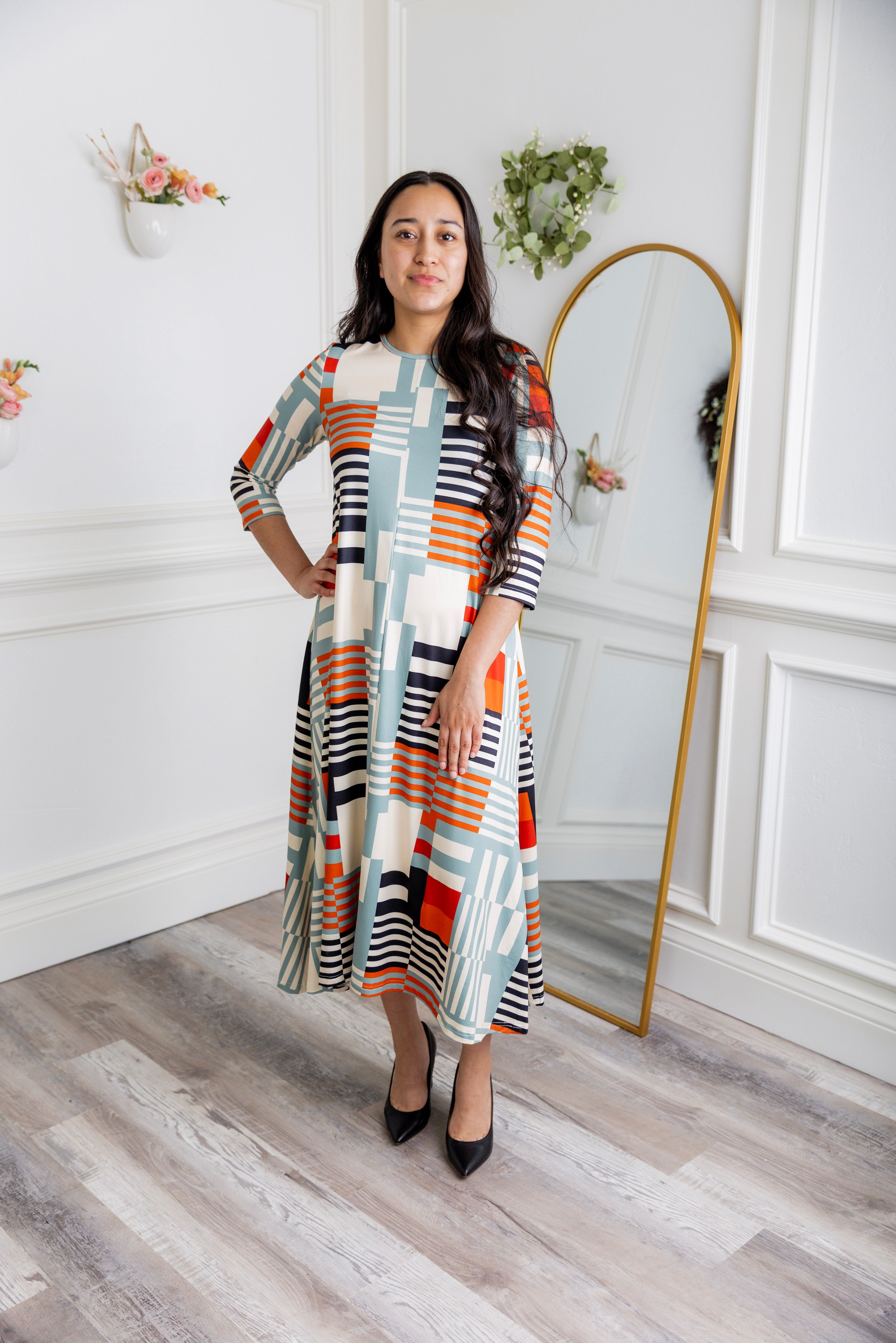 Model wearing the Nuggles® Liana Dress – modest midi dress with ¾ sleeves