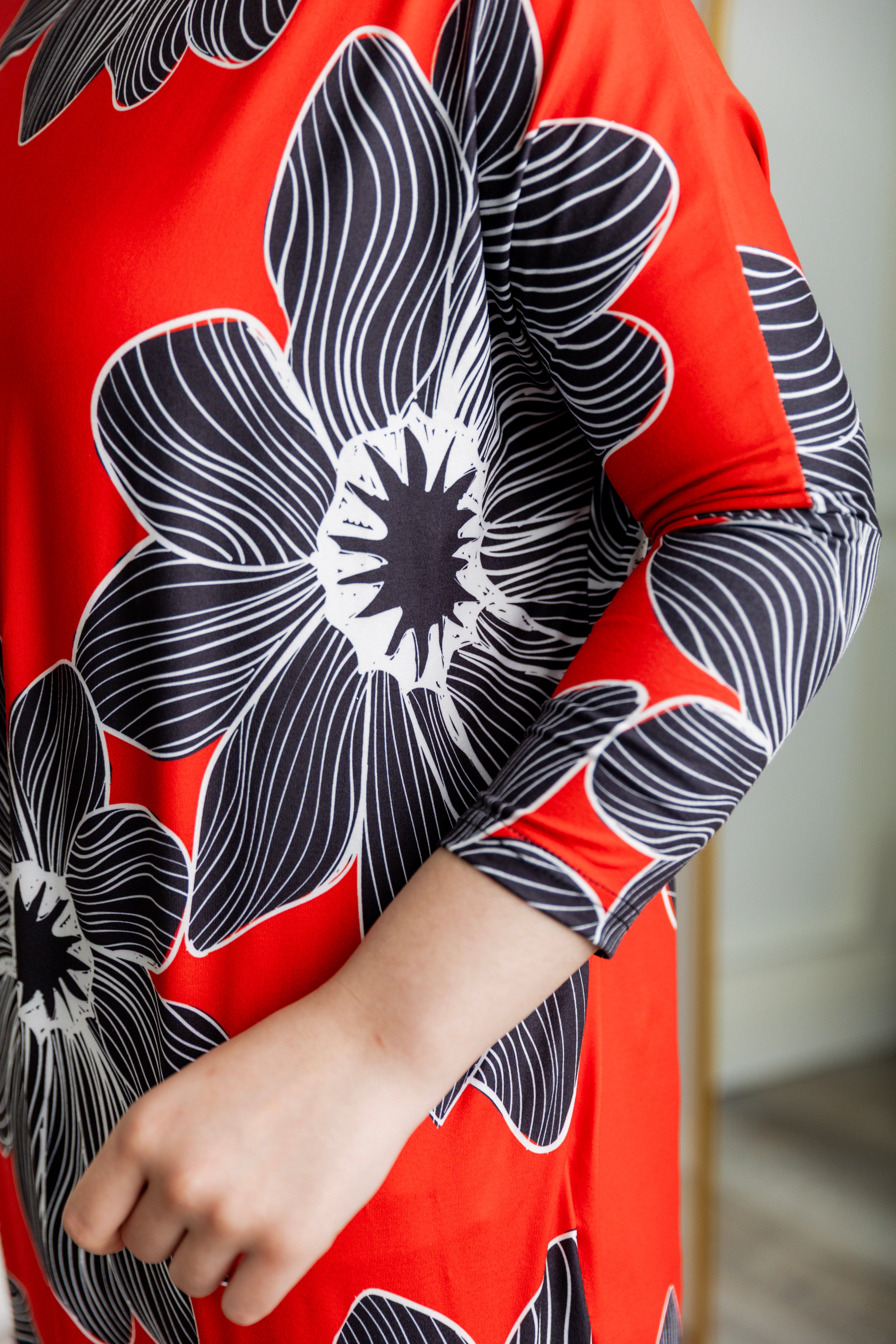 Modest dolman sleeve dress for women with relaxed fit and tapered hem, made from soft stretch knit fabric – perfect for everyday wear.