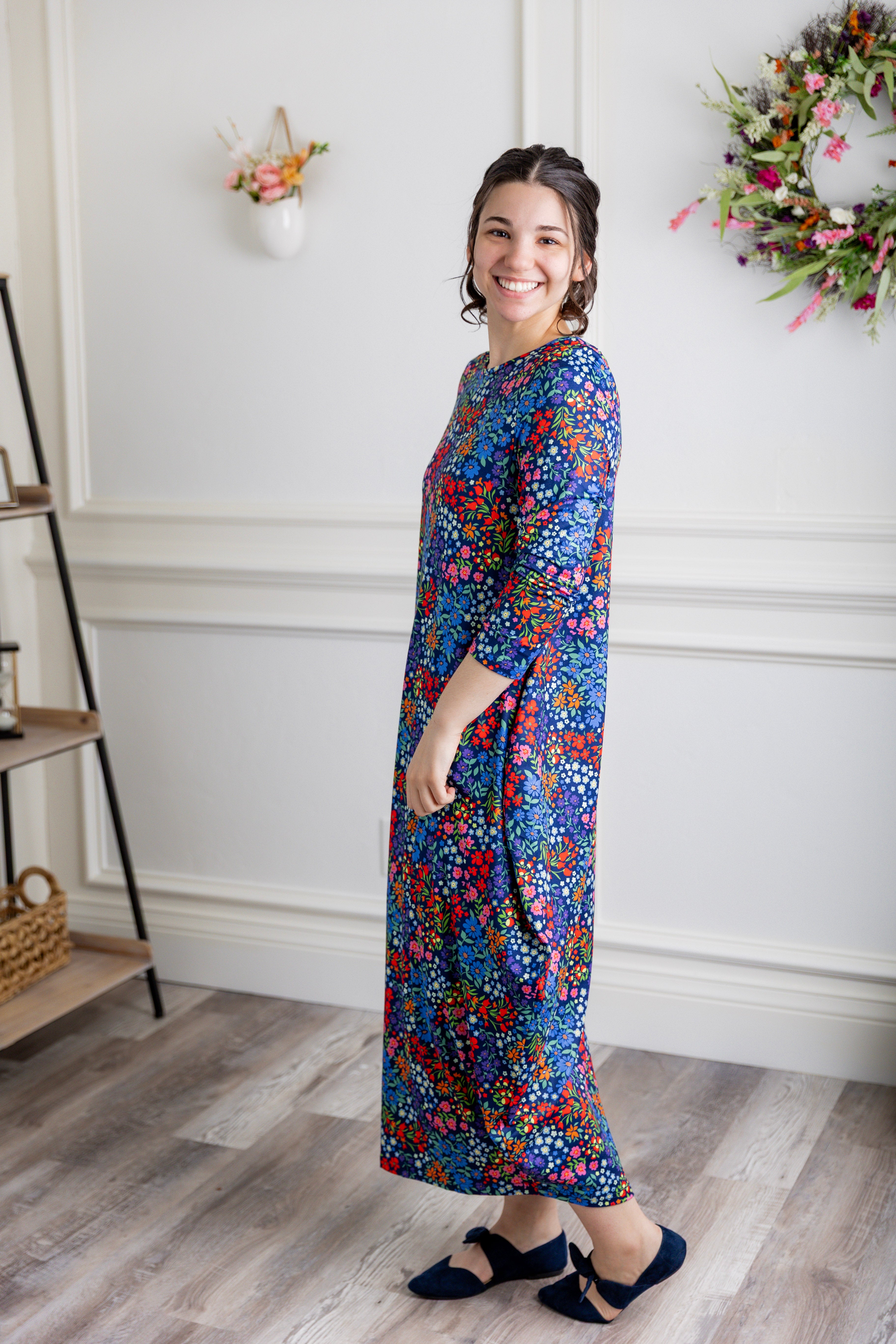 Model wearing Emma Bubble Dress in pretty prints, showcasing full bubble skirt and modest fit.