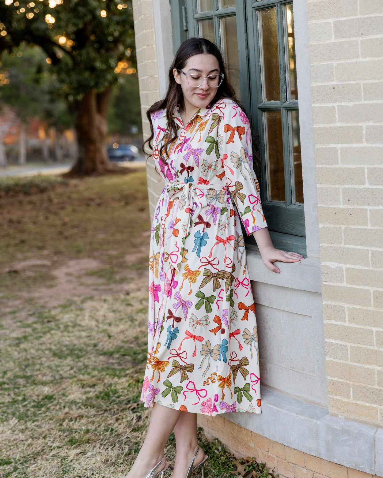 Model wearing the Nuggles® Rachel Dress in Bow Garden