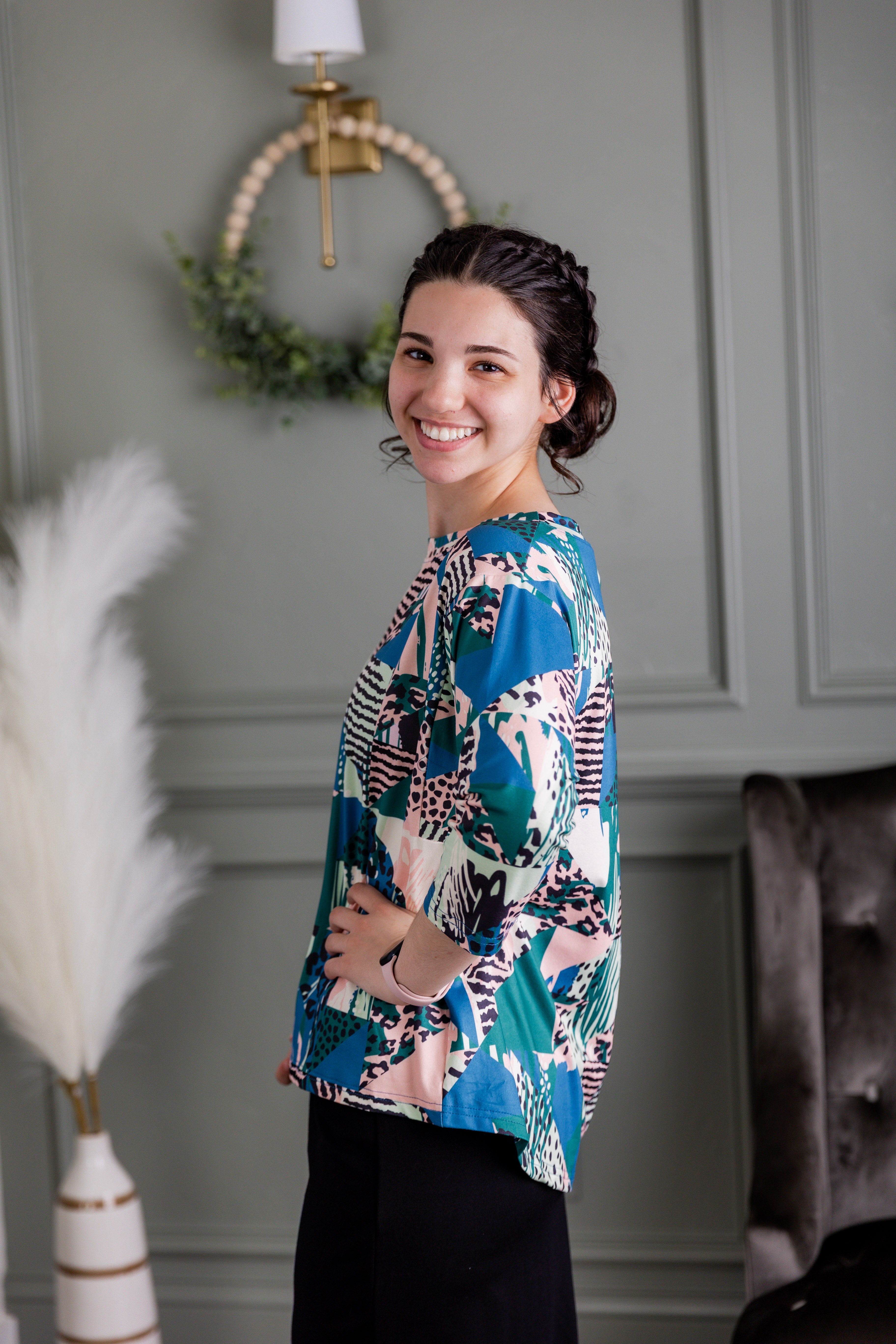 Model wearing the Nuggles® Lucia Top in Neon Boardwalk