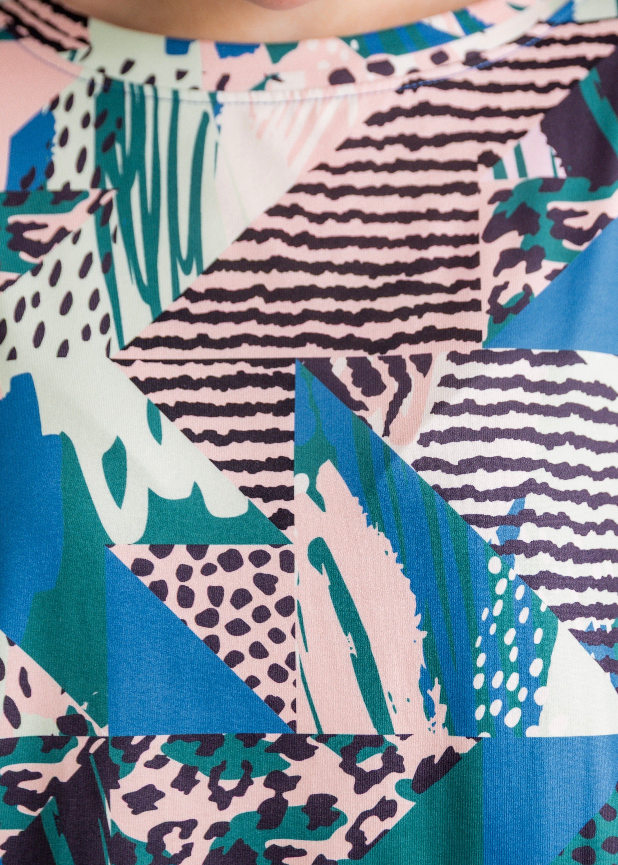 Model wearing the Nuggles® Lucia Top in Neon Boardwalk