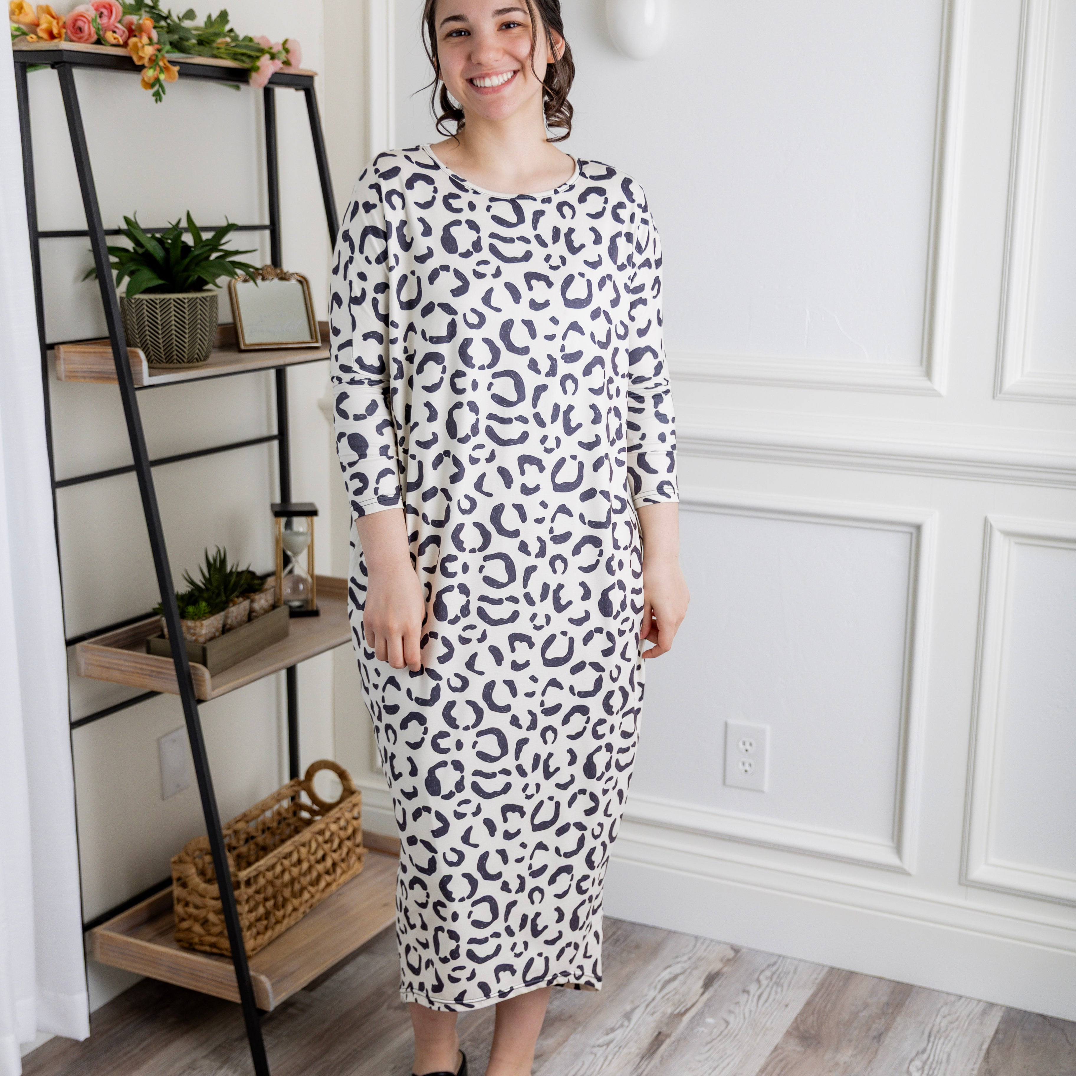 Modest dolman sleeve dress for women with relaxed fit and tapered hem, made from soft stretch knit fabric – perfect for everyday wear.