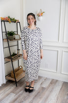 Modest dolman sleeve dress for women with relaxed fit and tapered hem, made from soft stretch knit fabric – perfect for everyday wear.