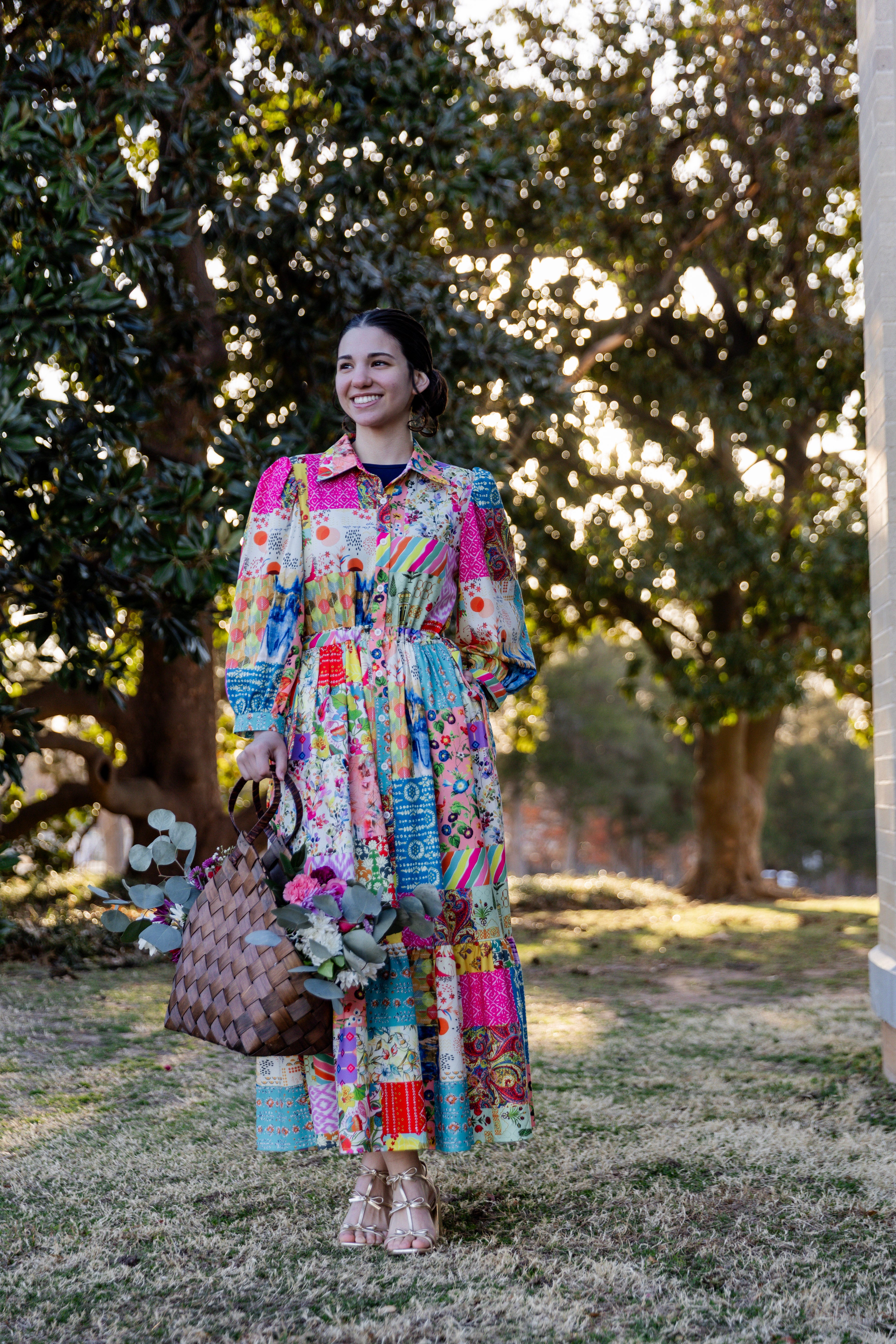 Model wearing the Nuggles® Leila Dress in Keepsake Quilt