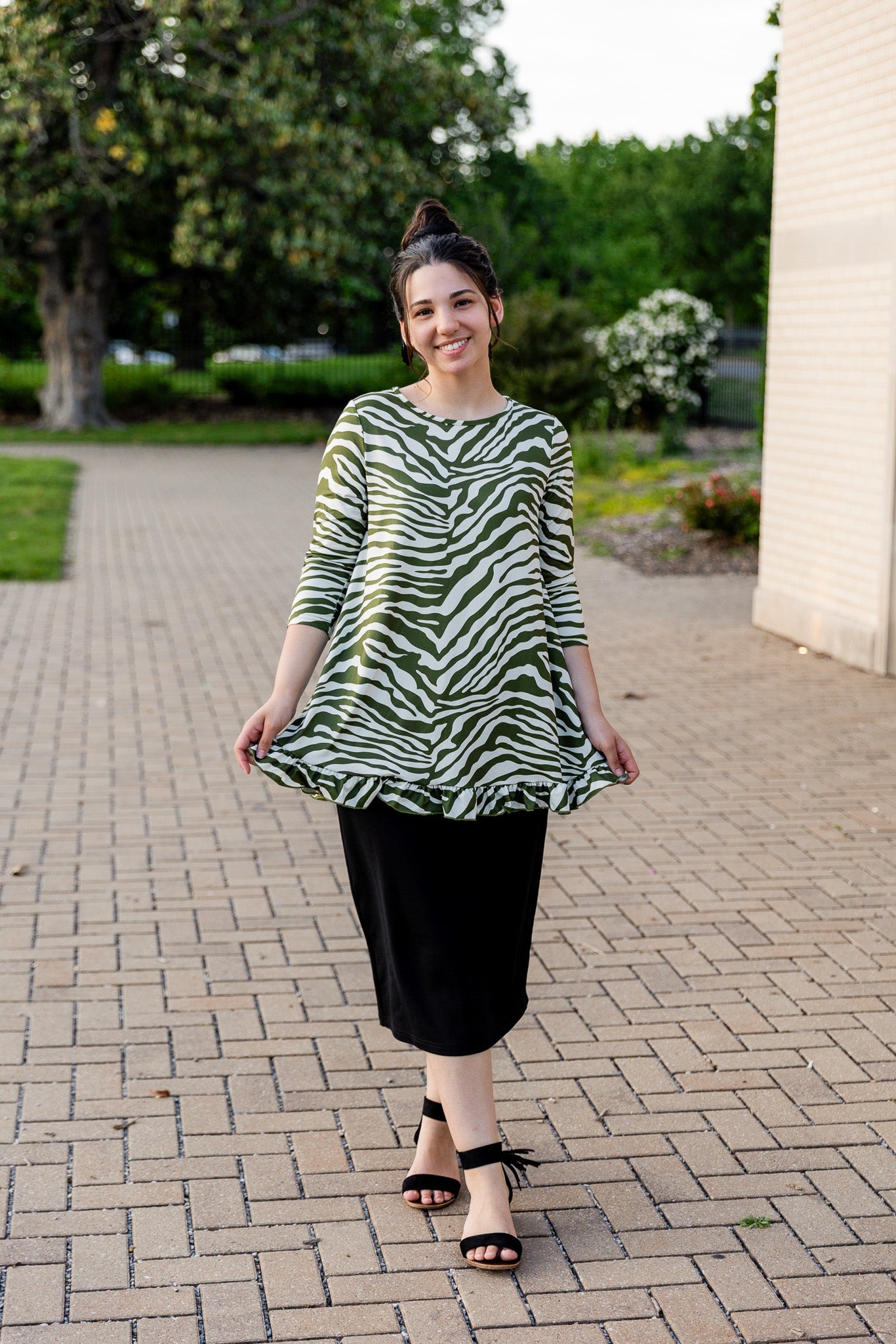 Model wearing the Avery Top, featuring modest 3/4 sleeves and a flowy, flattering fit.