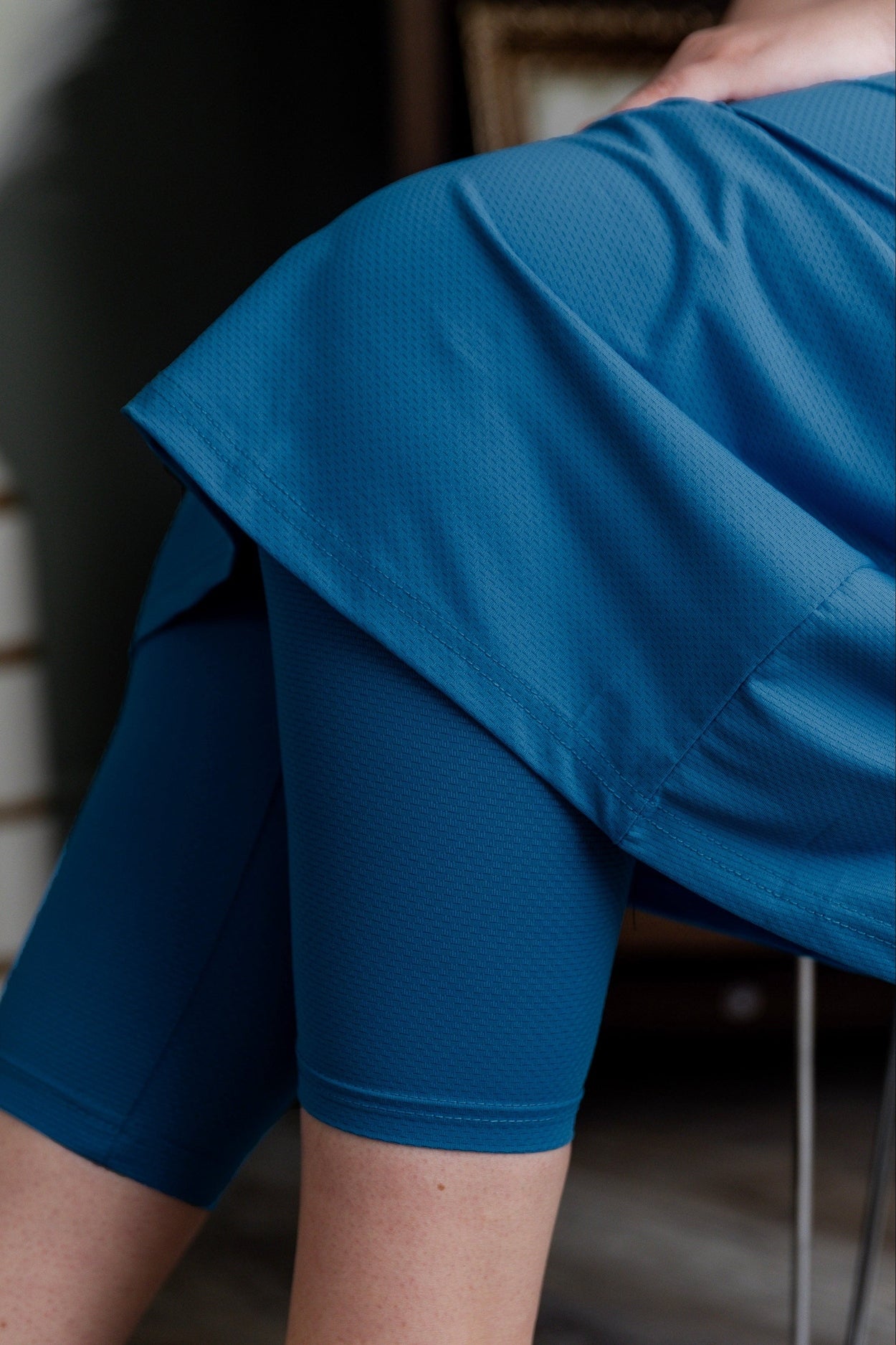 Model wearing Nuggles® 31" All-Sport Skirt in Turquoise