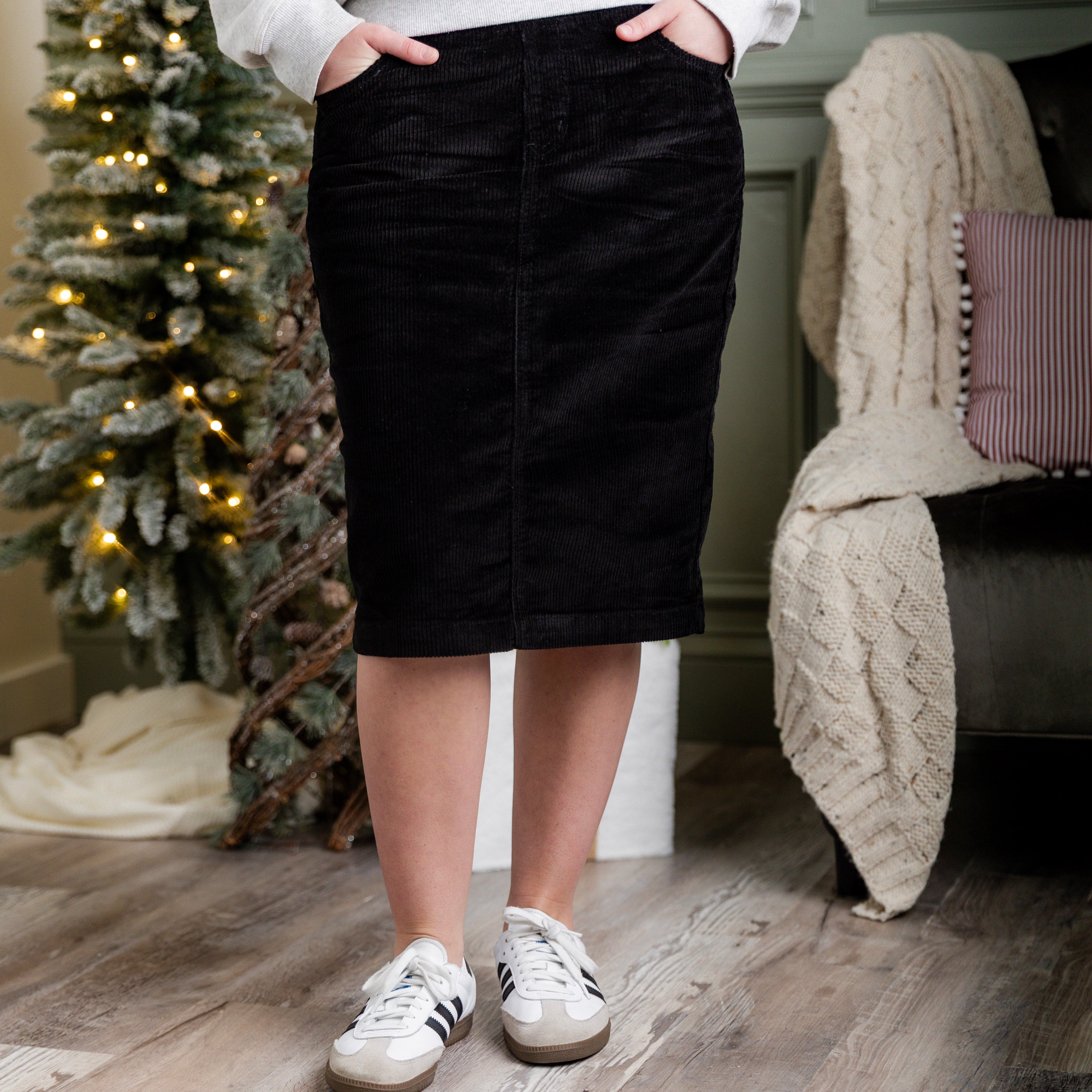 Model wearing Nuggles® 25-inch corduroy skirt