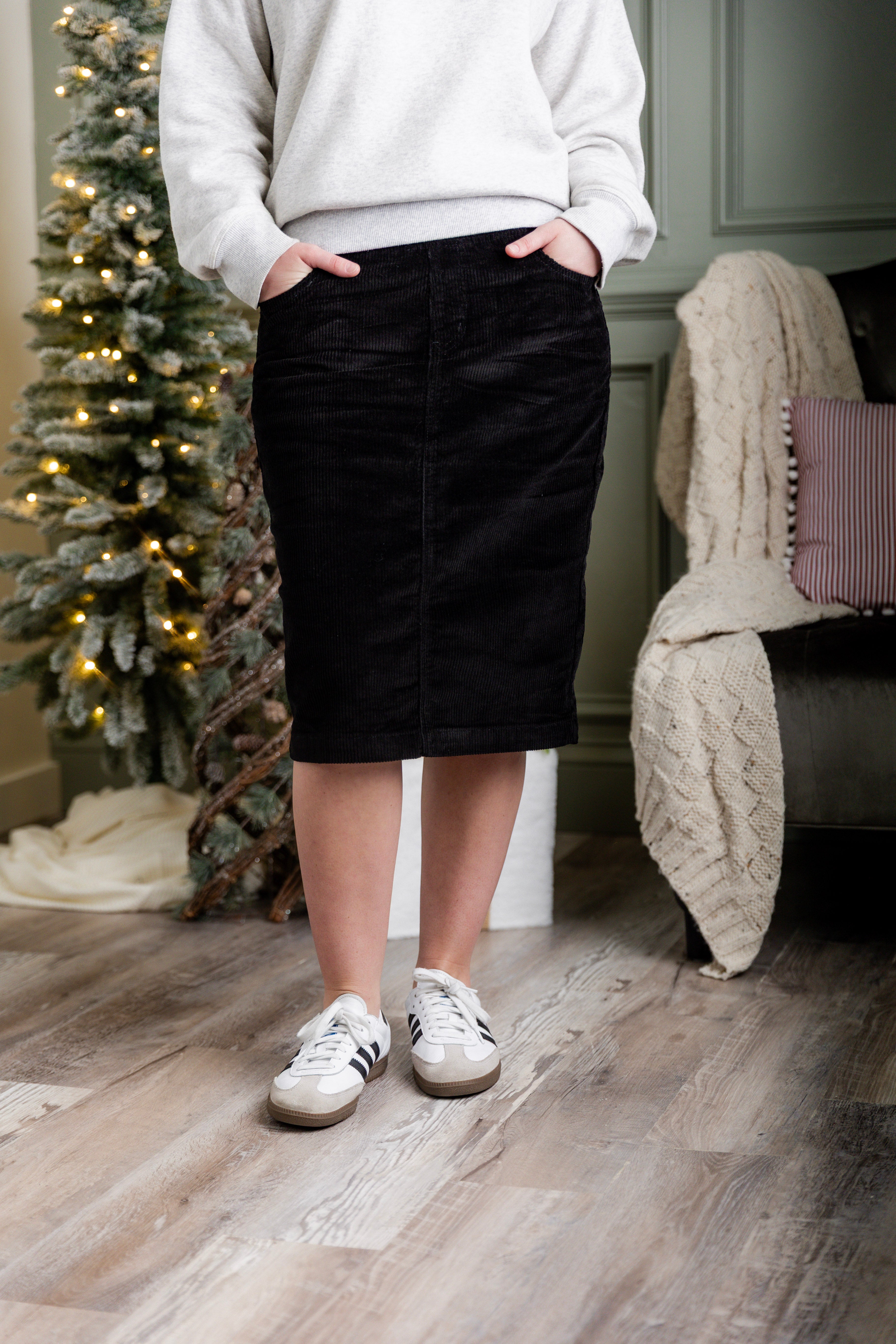 Model wearing Nuggles® 25-inch corduroy skirt