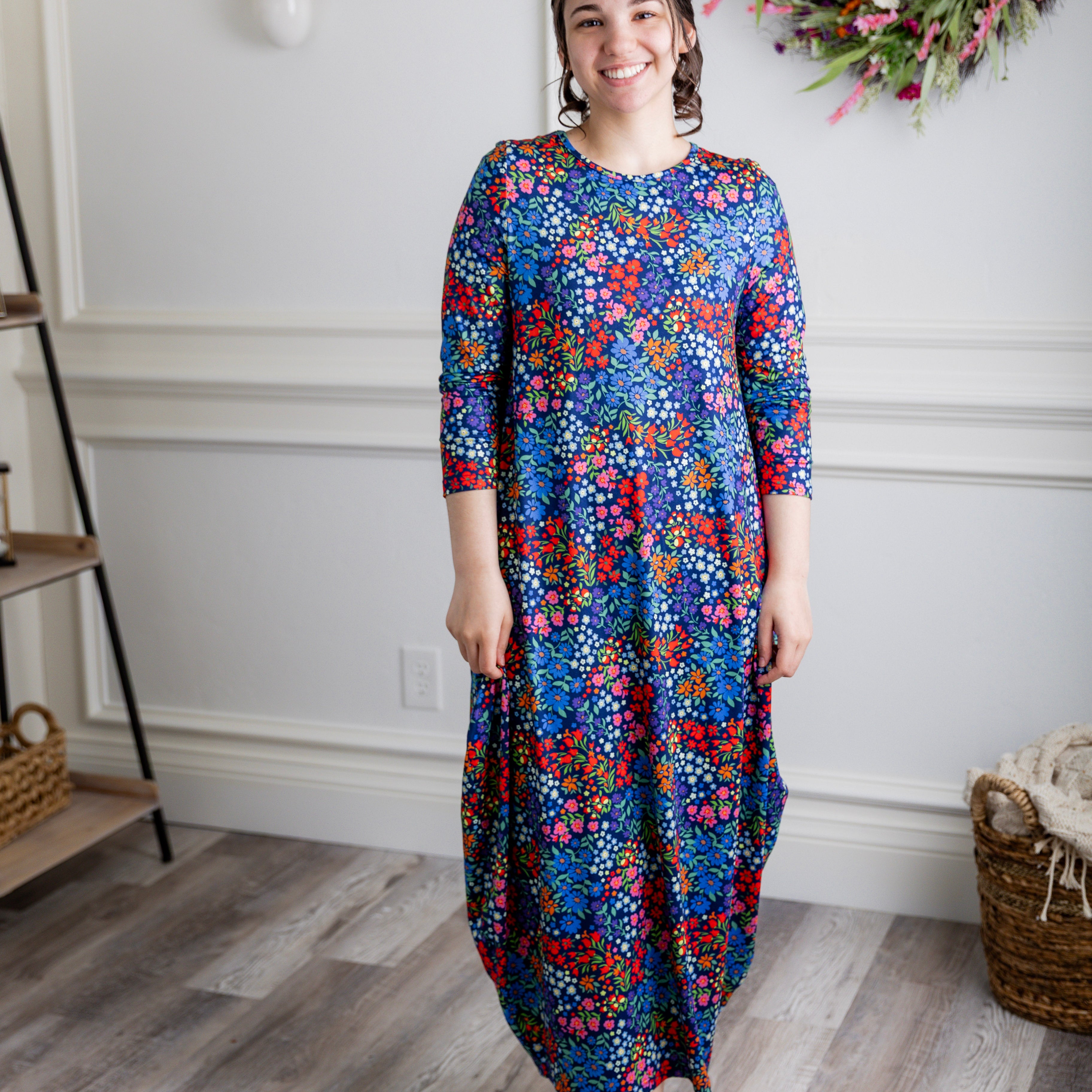 Model wearing Emma Bubble Dress in pretty prints, showcasing full bubble skirt and modest fit.