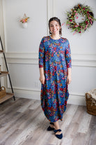 Model wearing Emma Bubble Dress in pretty prints, showcasing full bubble skirt and modest fit.