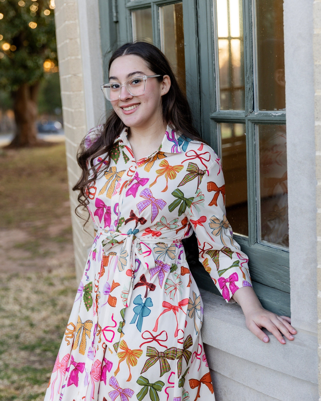 Model wearing the Nuggles® Rachel Dress in Bow Garden