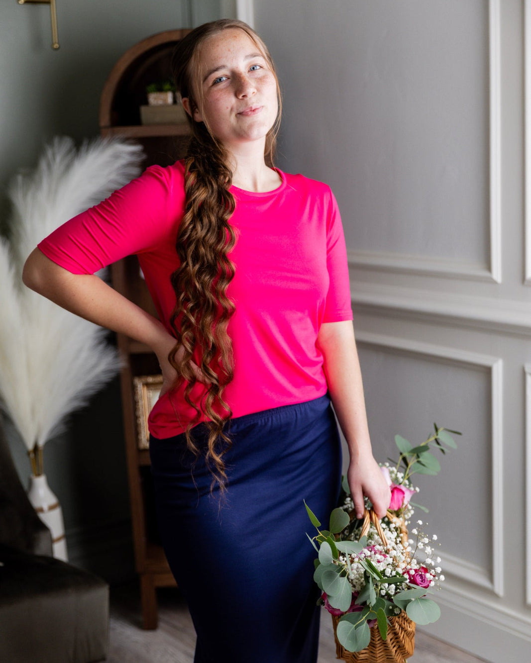 Model wearing the Nuggles® Essential Half Sleeve Tee in Hot Pink