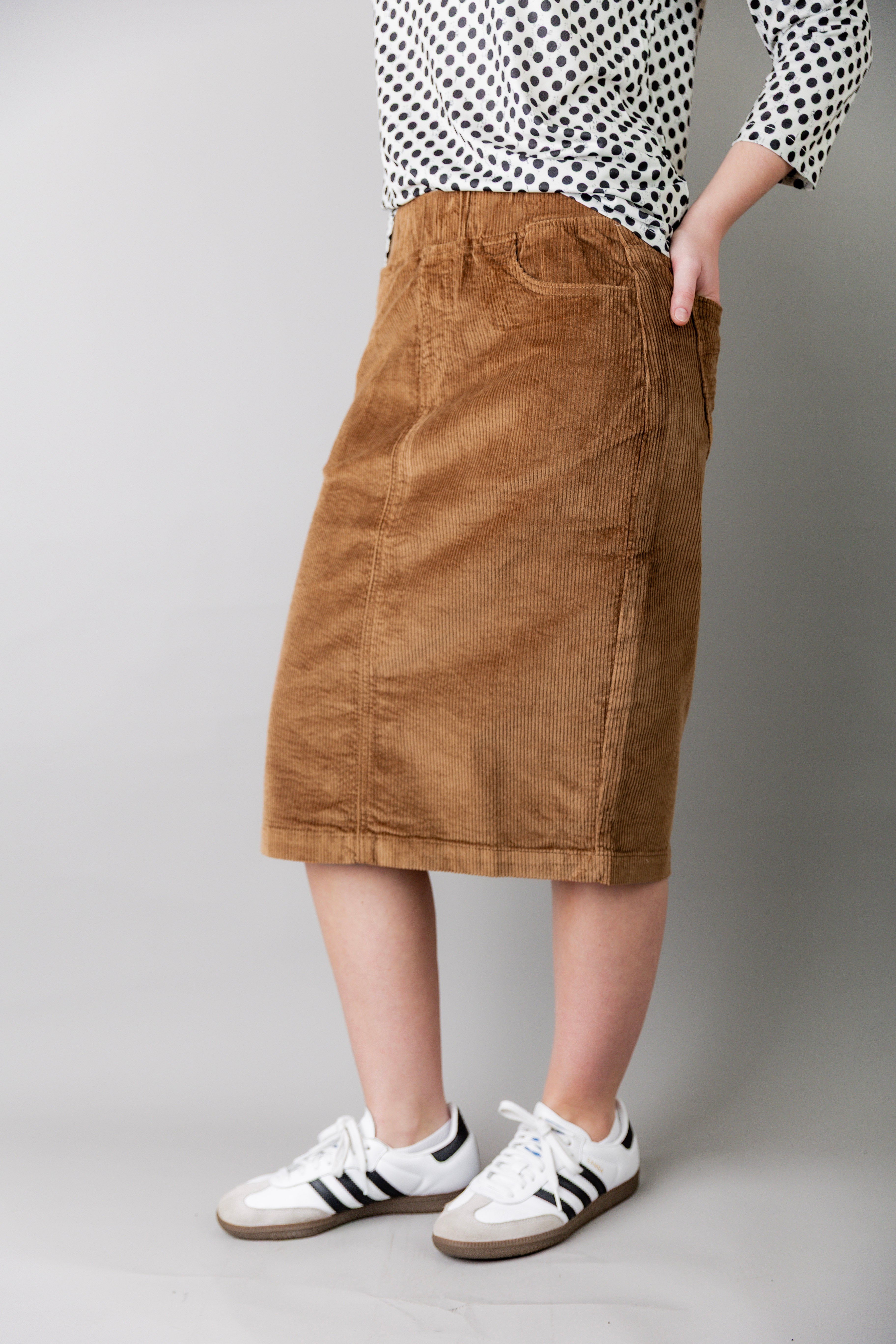 Model wearing Nuggles® 25-inch corduroy skirt