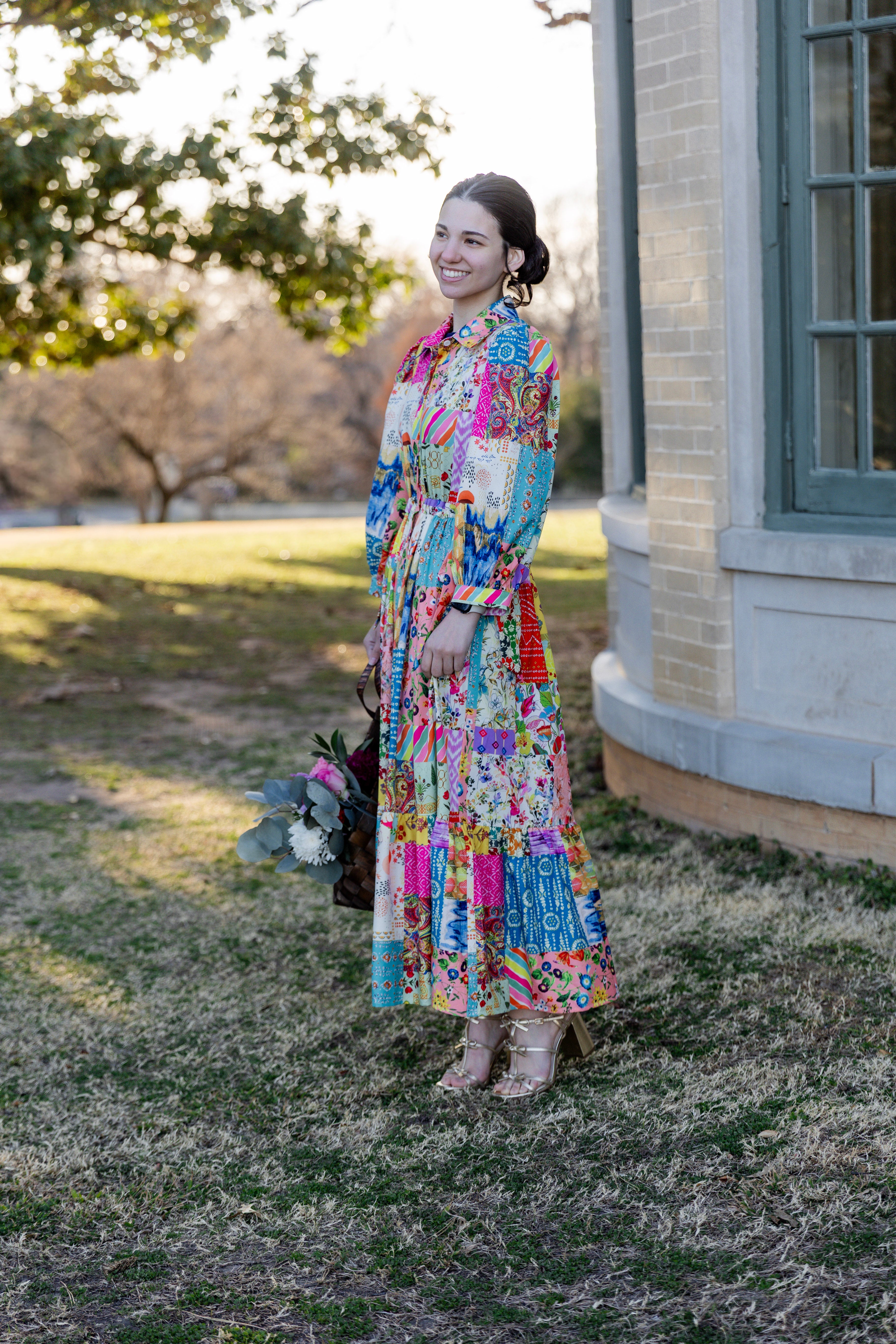 Model wearing the Nuggles® Leila Dress in Keepsake Quilt