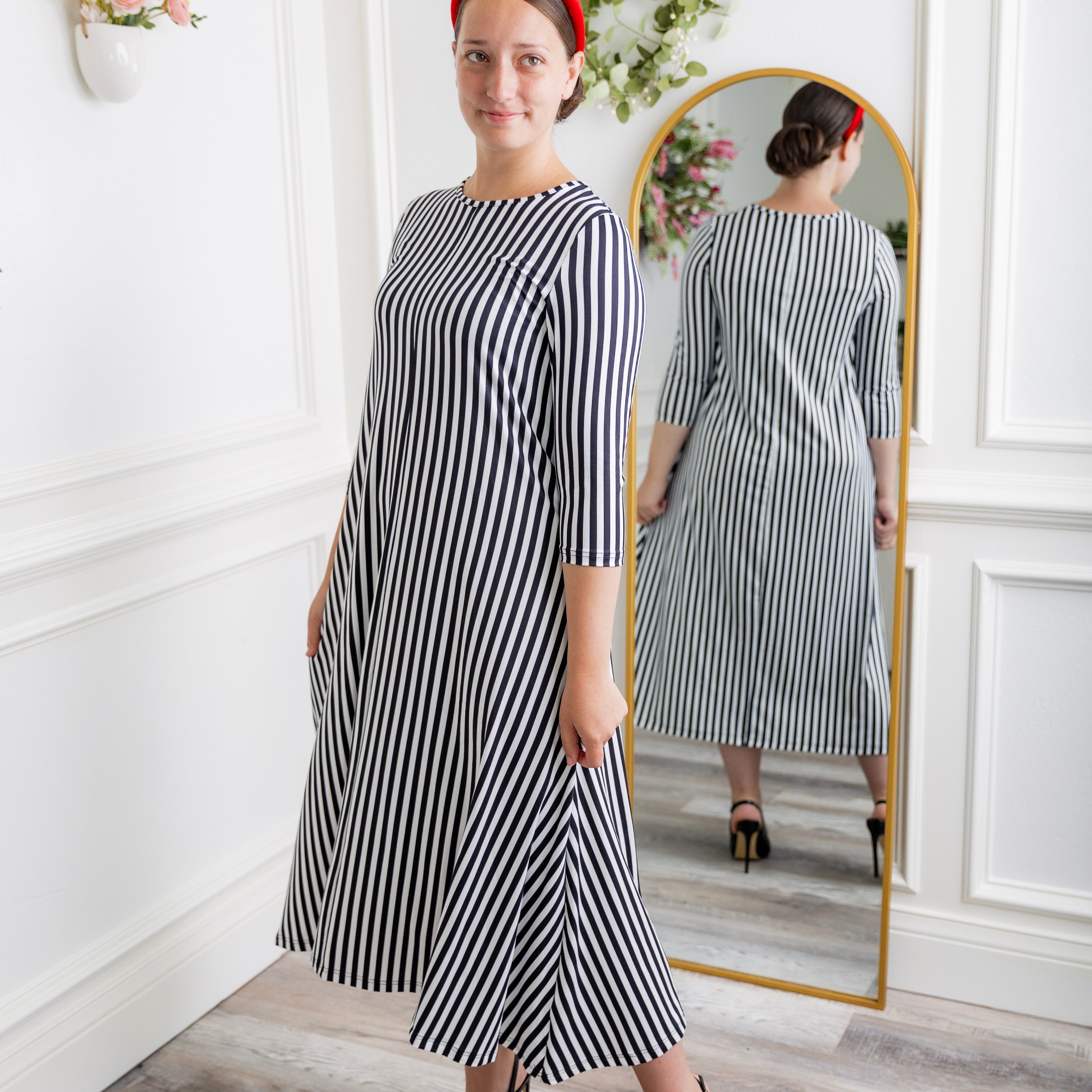 Model wearing the Nuggles® Liana Dress – modest midi dress with ¾ sleeves