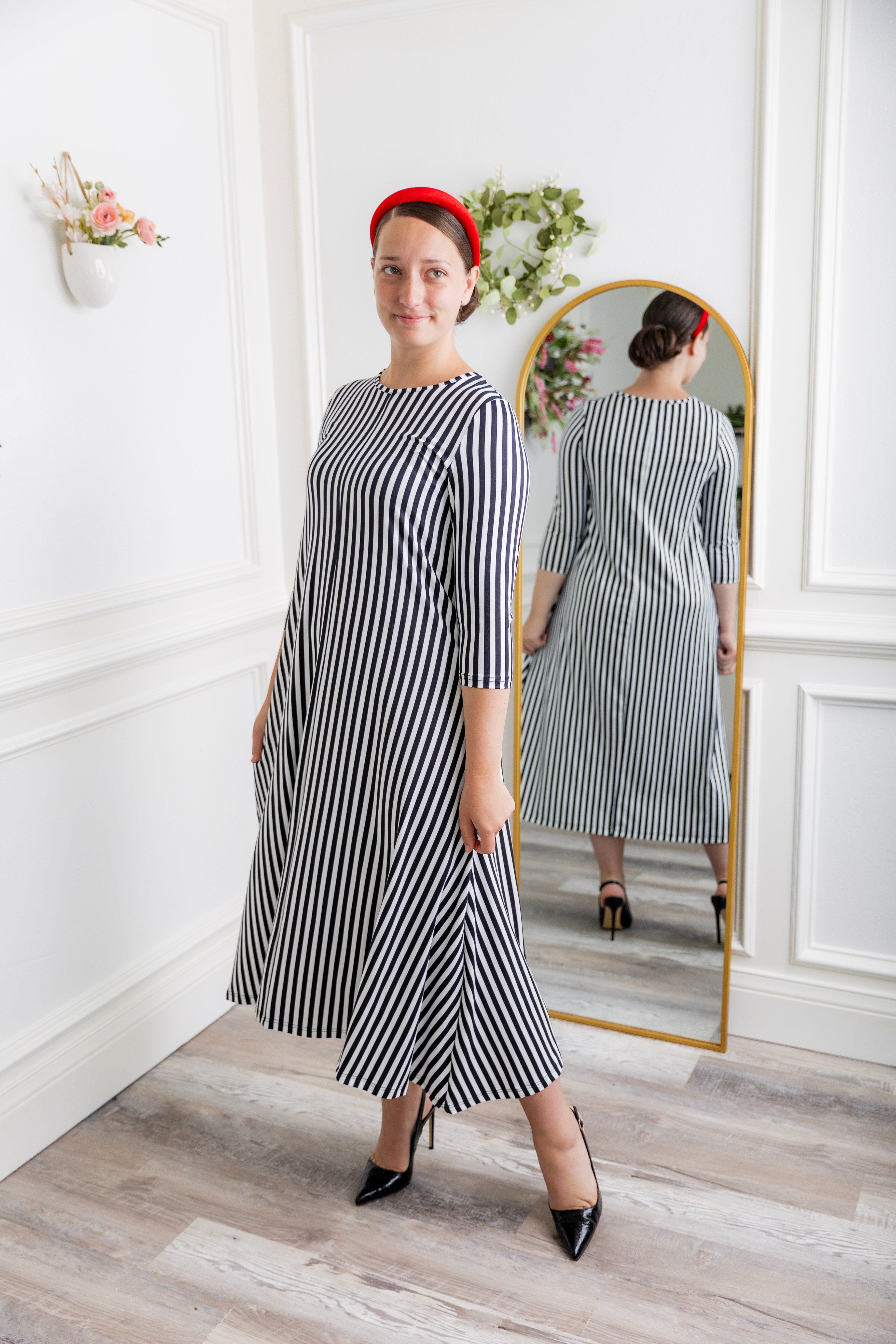Model wearing the Nuggles® Liana Dress – modest midi dress with ¾ sleeves