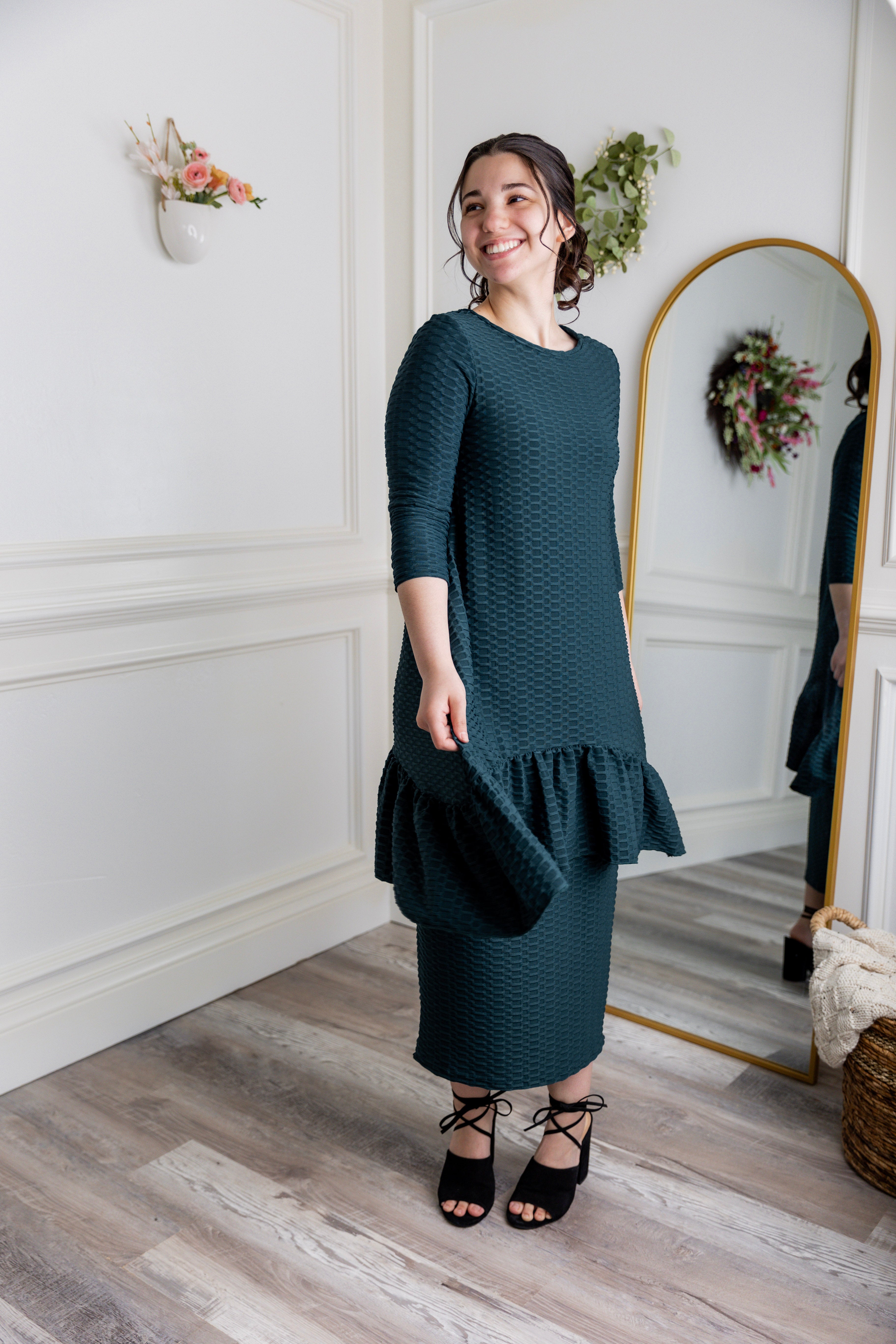 Textured midi-length skirt with elastic waistband and modest fit.
