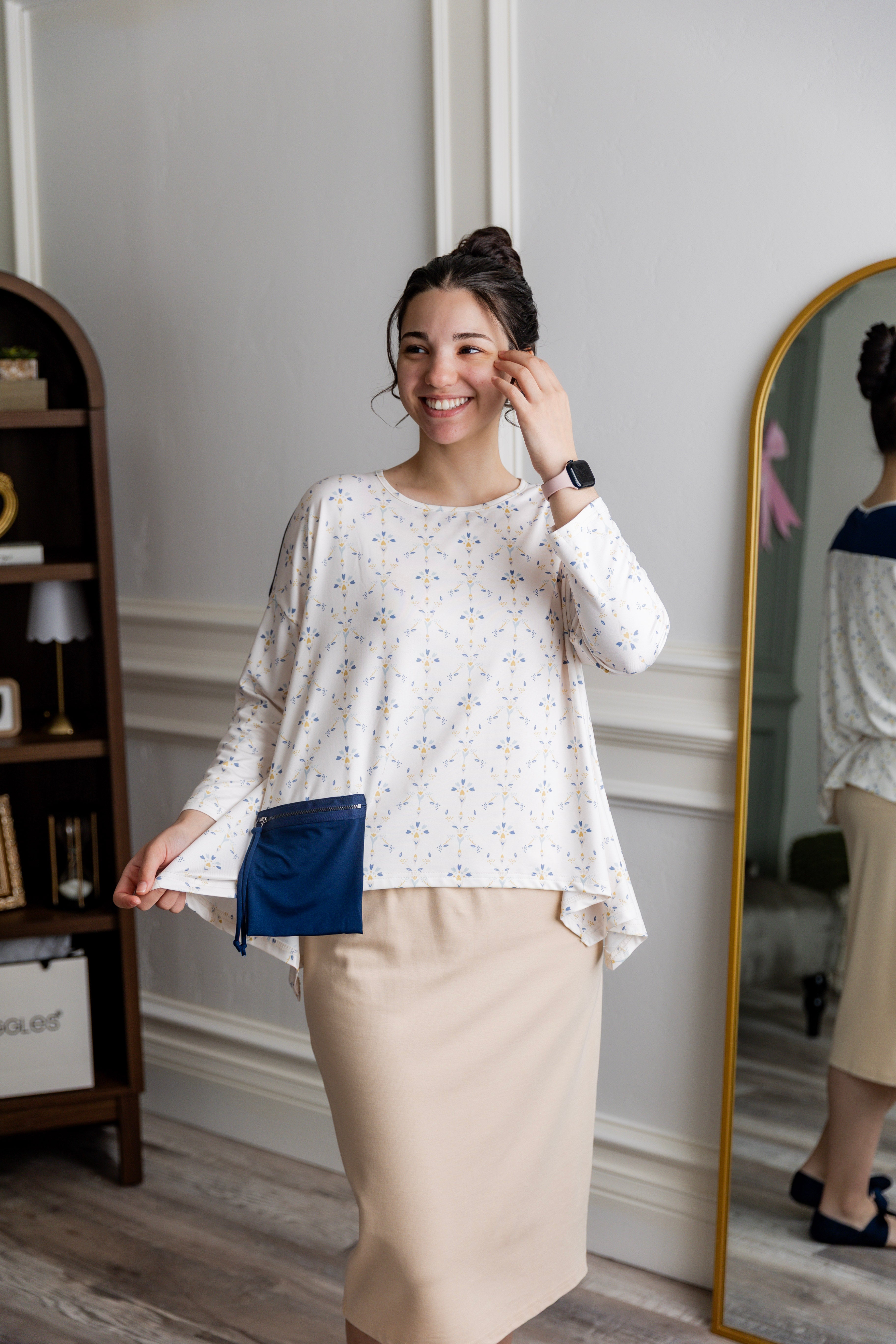 Model wearing the Nuggles® Keegan Top in Dewdrop Ivory floral print modest boutique top